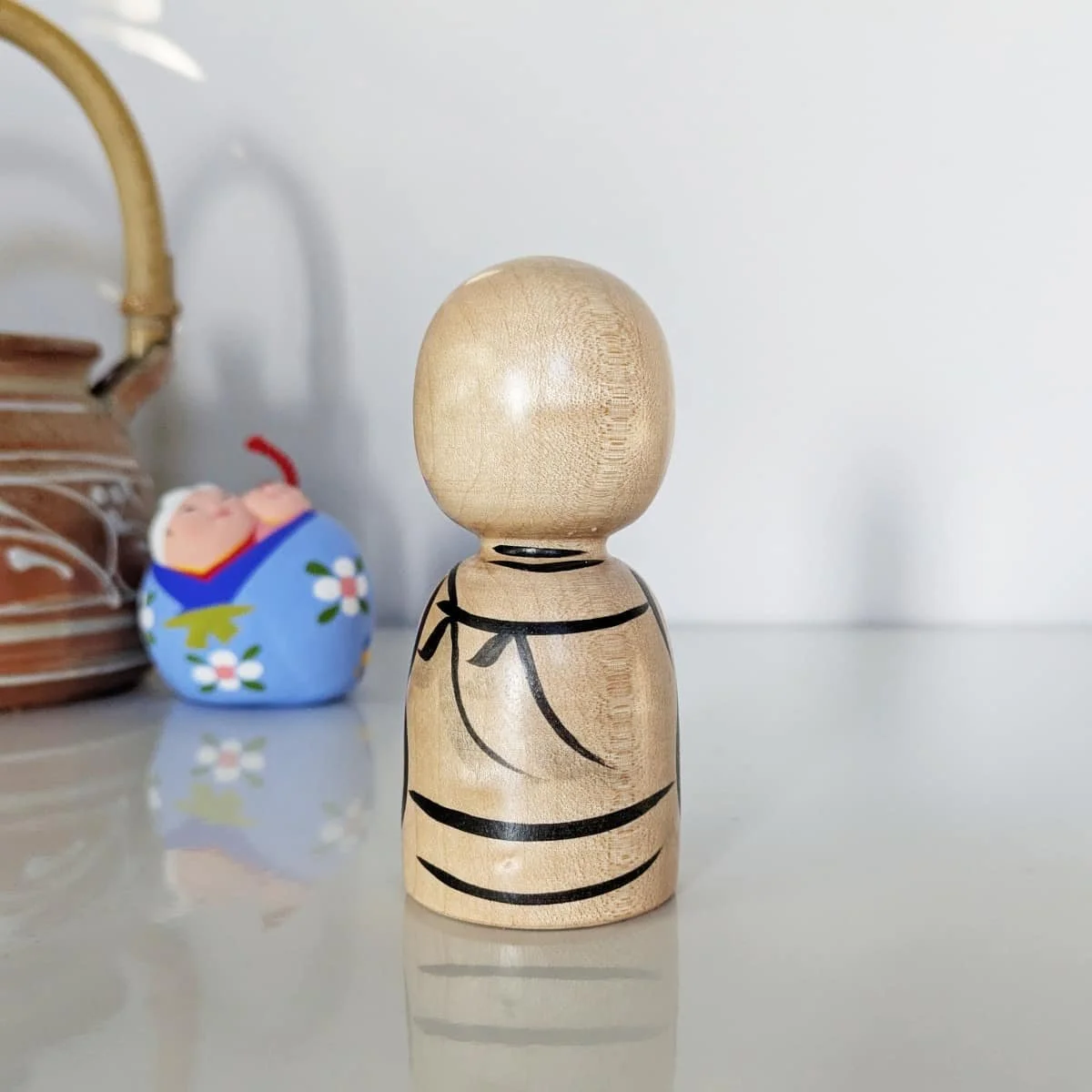 Petit jizo en érable souriant