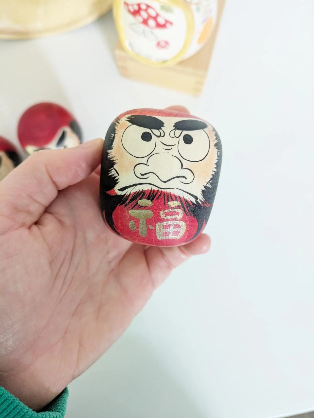 Daruma en bois par Sato Yusuke - au choix