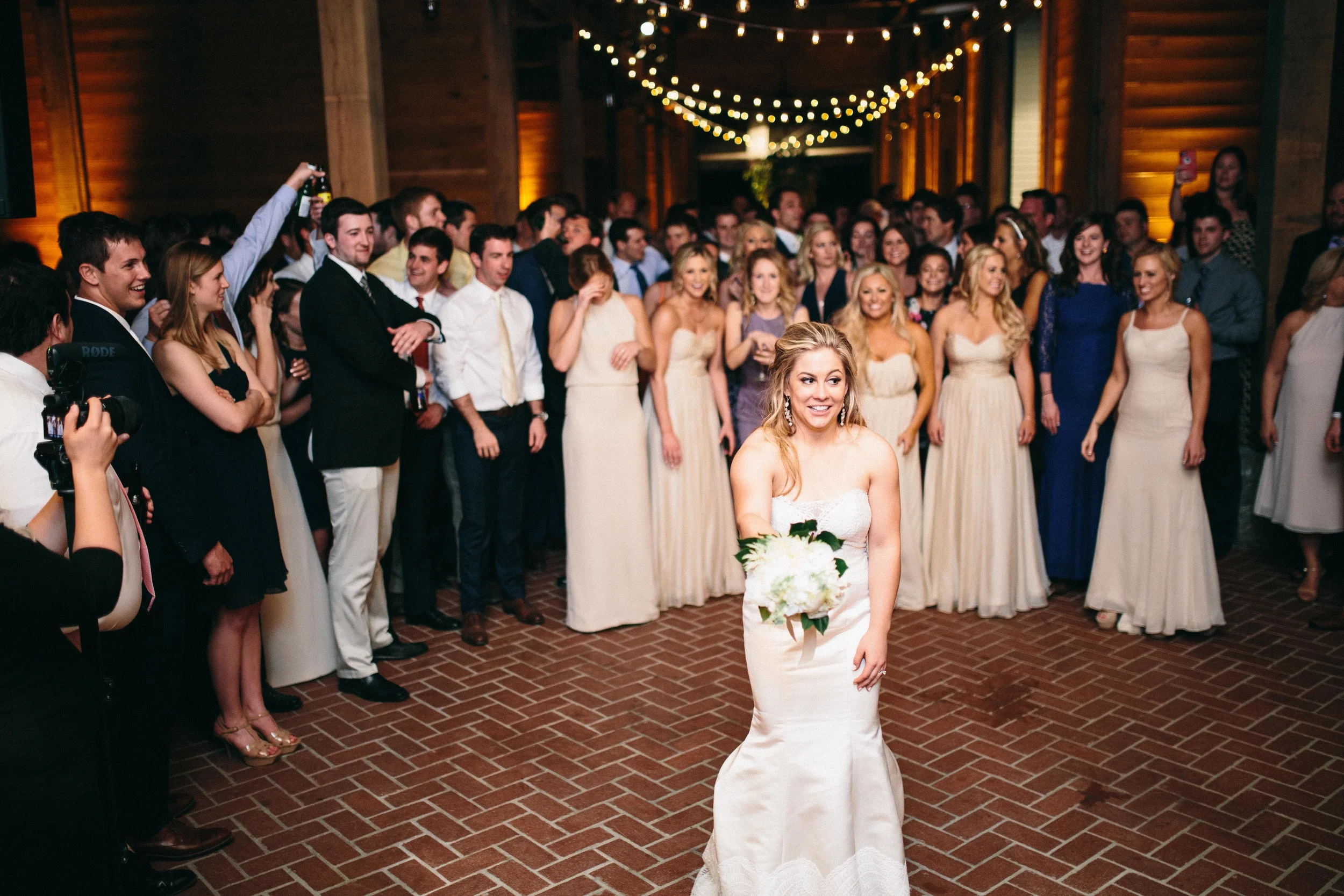 fetenashville.com | Franklin Wedding at Trinity View Farm | Shawn Johnson Gets Married to Andrew East | Fete Nashville Wedding Planning and Design | best wedding planner | nashville best wedding planner | Luxury Weddings | Celebrity Wedding Planner | bouquet toss | Olia Zavozina wedding dress
