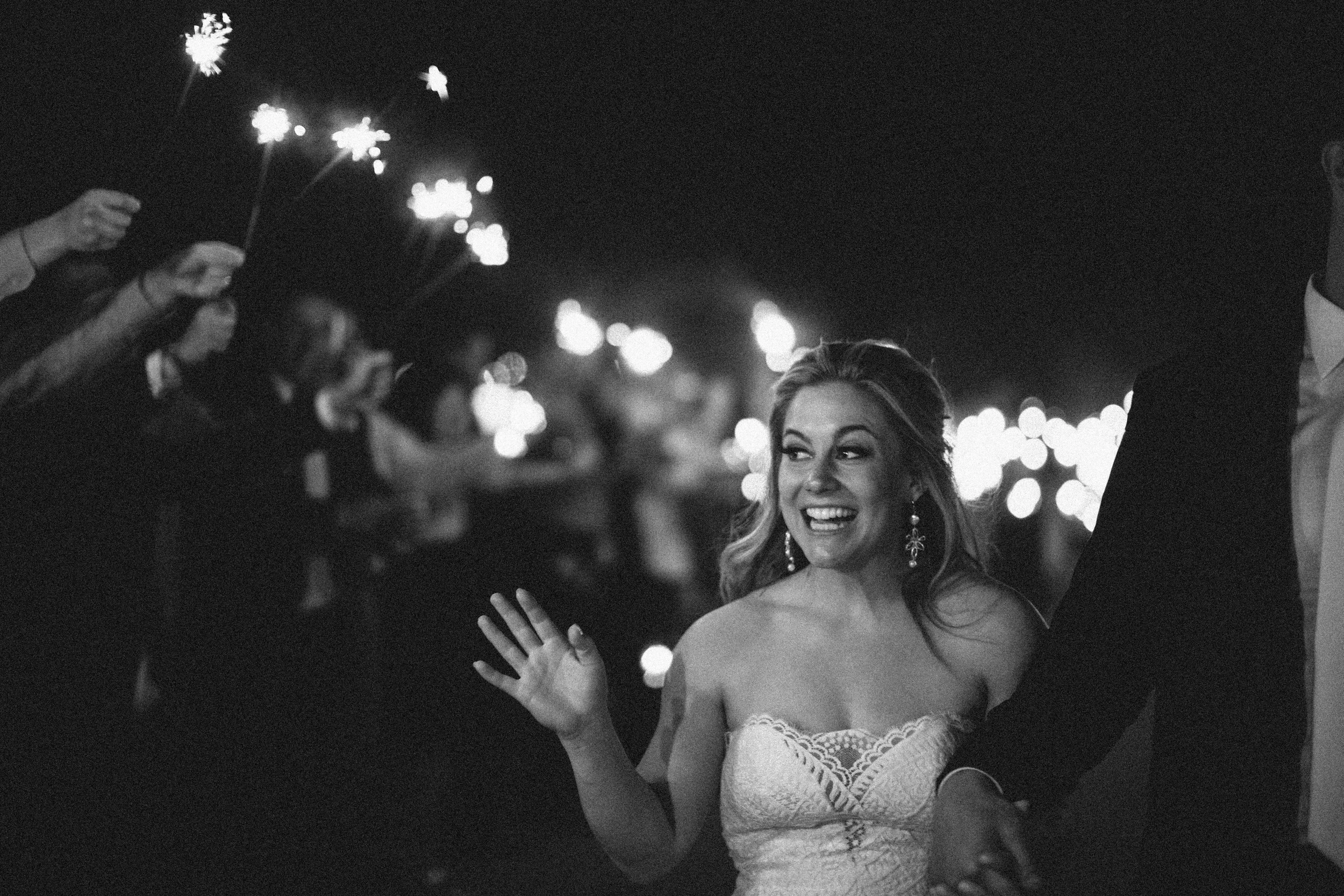 fetenashville.com | Franklin Wedding at Trinity View Farm | Shawn Johnson Gets Married to Andrew East | Fete Nashville Wedding Planning and Design | best wedding planner | nashville best wedding planner | Luxury Weddings | Celebrity Wedding Planner | greenery hanging over head table | lace runner | exposed bulbs | celebrity bride | celebrity groom | farm wedding | farm tables | sparkler exit