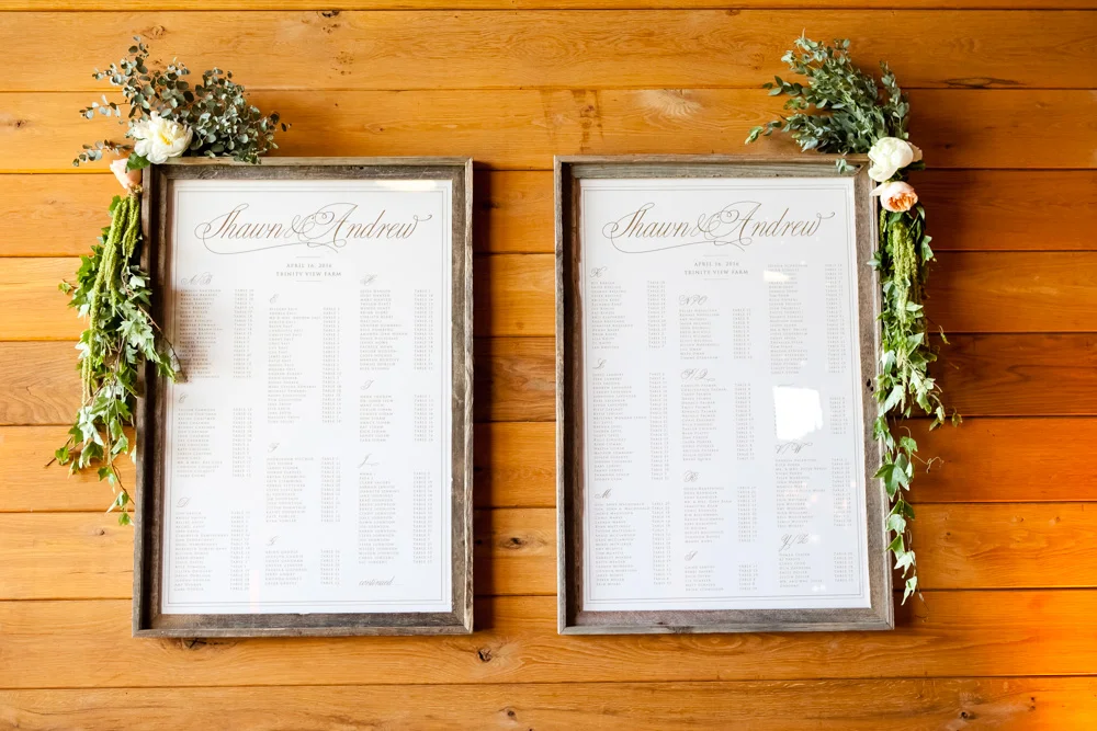 fetenashville.com | Franklin Wedding at Trinity View Farm | Shawn Johnson Gets Married to Andrew East | Fete Nashville Wedding Planning and Design | best wedding planner | nashville best wedding planner | Luxury Weddings | Celebrity Wedding Planner | greenery hanging over head table | lace runner | exposed bulbs | celebrity bride | celebrity groom | farm wedding | farm tables | seating charts | escort card board