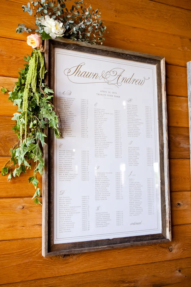 fetenashville.com | Franklin Wedding at Trinity View Farm | Shawn Johnson Gets Married to Andrew East | Fete Nashville Wedding Planning and Design | best wedding planner | nashville best wedding planner | Luxury Weddings | Celebrity Wedding Planner | greenery hanging over head table | lace runner | exposed bulbs | celebrity bride | celebrity groom | farm wedding | farm tables