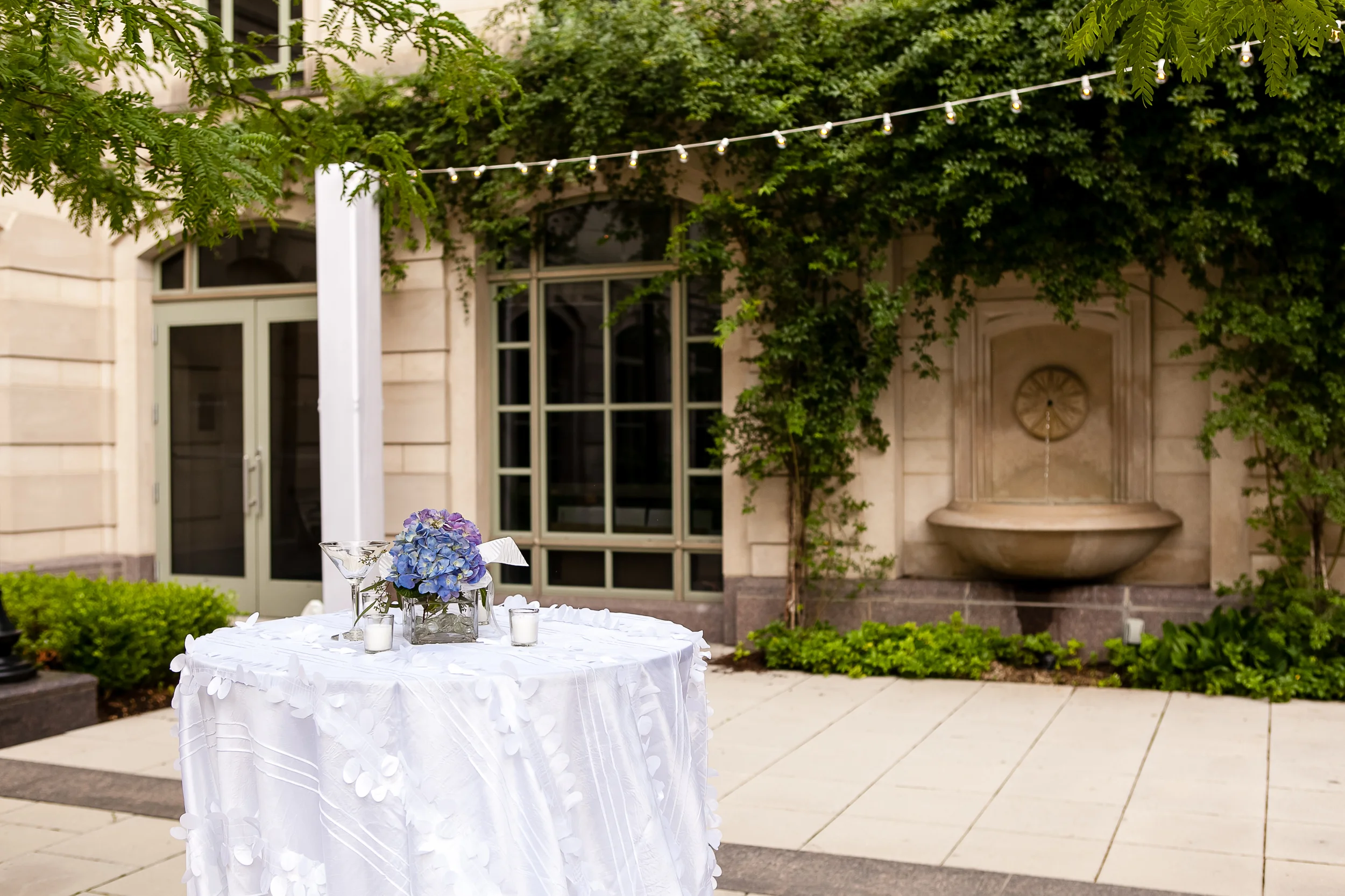 fetenashville.com | Schermerhorn Symphony Center Wedding | Luxury Weddings and Events Designed by Fete Nashville | Photographed by Kristyn Hogan and Erin Lee | best wedding planner nashville | purple and white wedding | silver wedding | nashville wedding planner | hydrangea wedding bouquet | Vera Wang wedding dress | luxury wedding planner | celebrity wedding planner | monogram invitations | white calligraphy | Scarritt Bennett | Wightman Chapel | cocktail hour in courtyard | wildflower linens