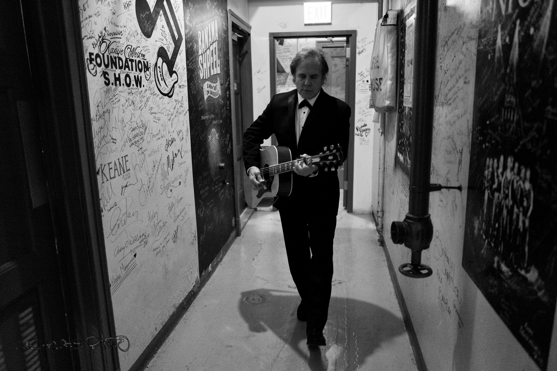 Mike Wanchic tunes his guitar backstage.