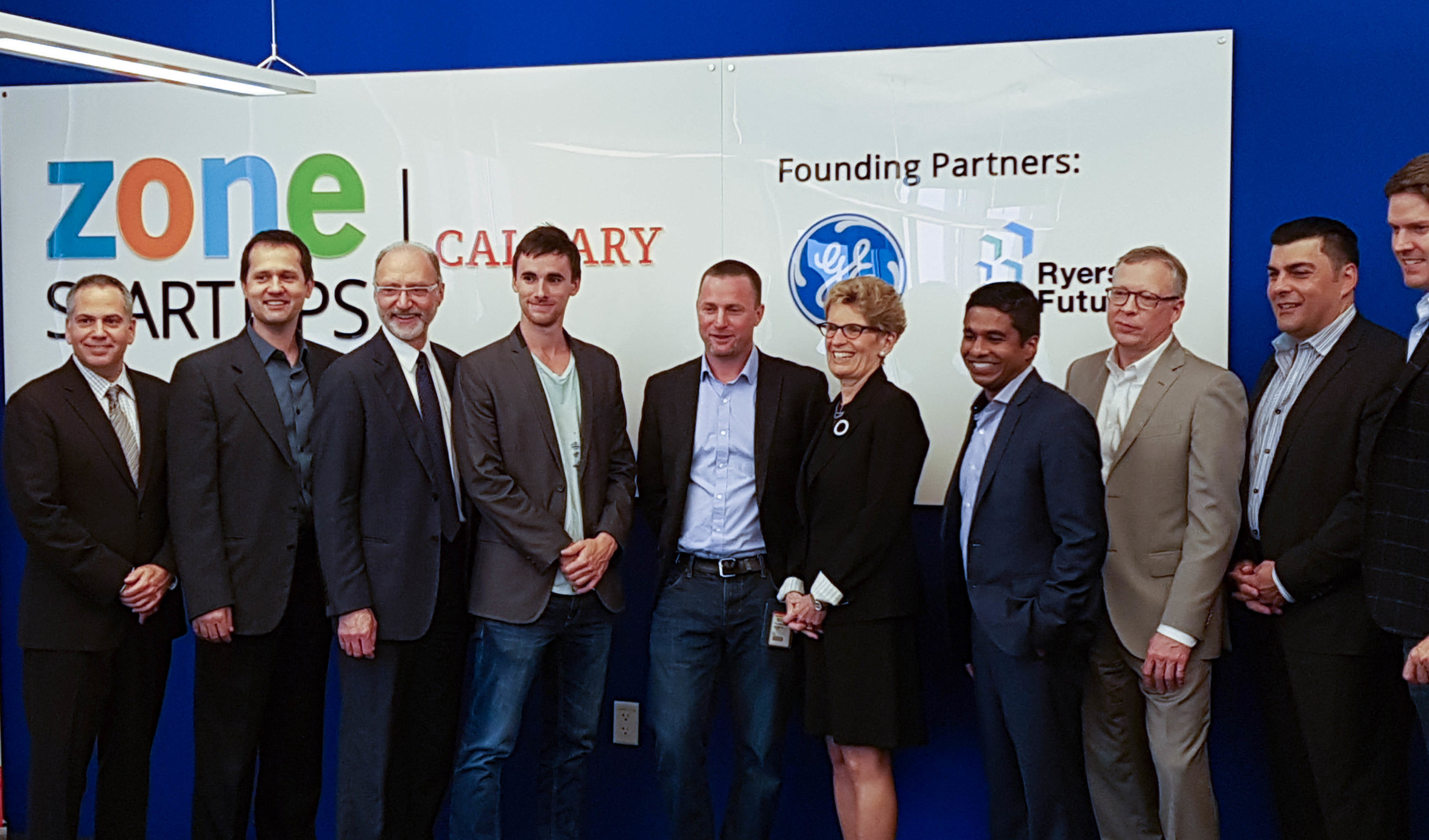 From the left, Stream System's Bruno Rizzuto, Dumitru Cernelev and Allan Chegus with Ontario Premier Kathleen Wynne (centre), and GE CIO Gandeephan Ganeshalingam (right of Wynne).