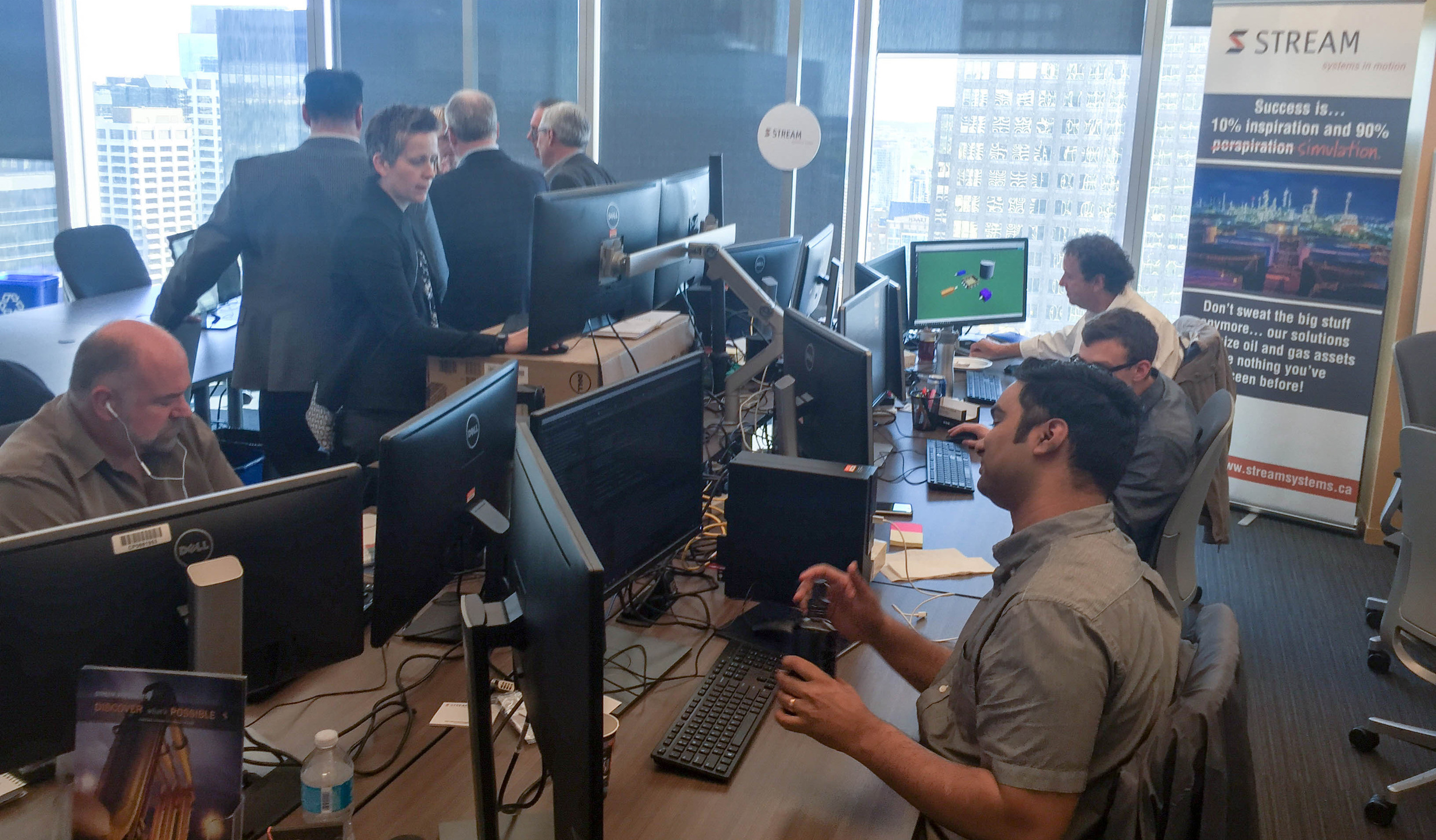 Our development team working on the cloud version of Stream's software. If you look closely you can see the drag and drop interface that Richard is working on...