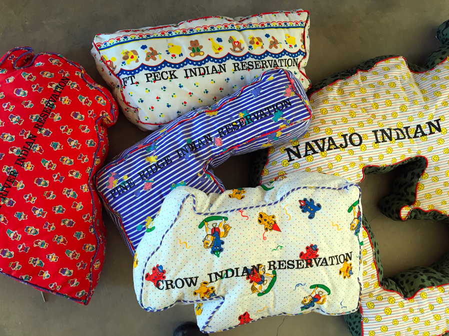 Reservations, 2011 fabric, paint; 5 pillows, installation variable