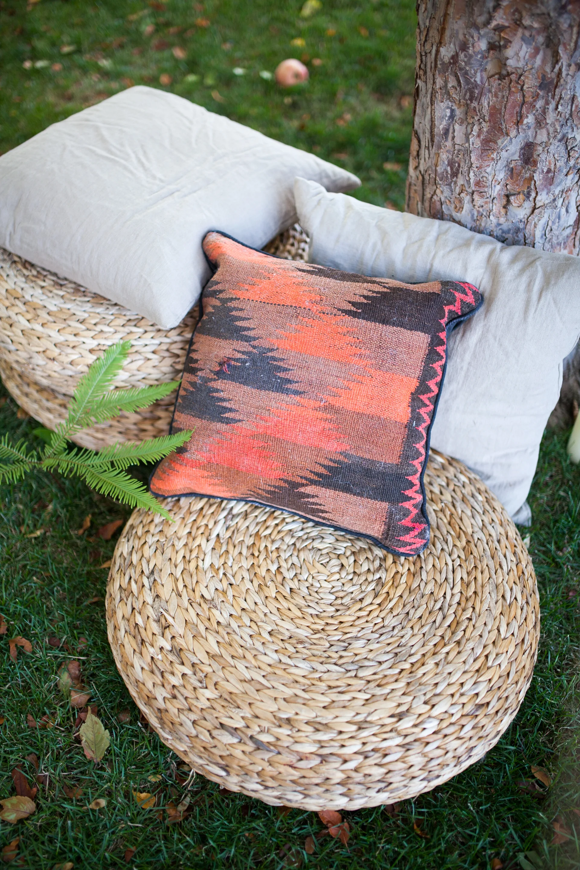 Moroccan Pillow and Rattan Poufs.jpg