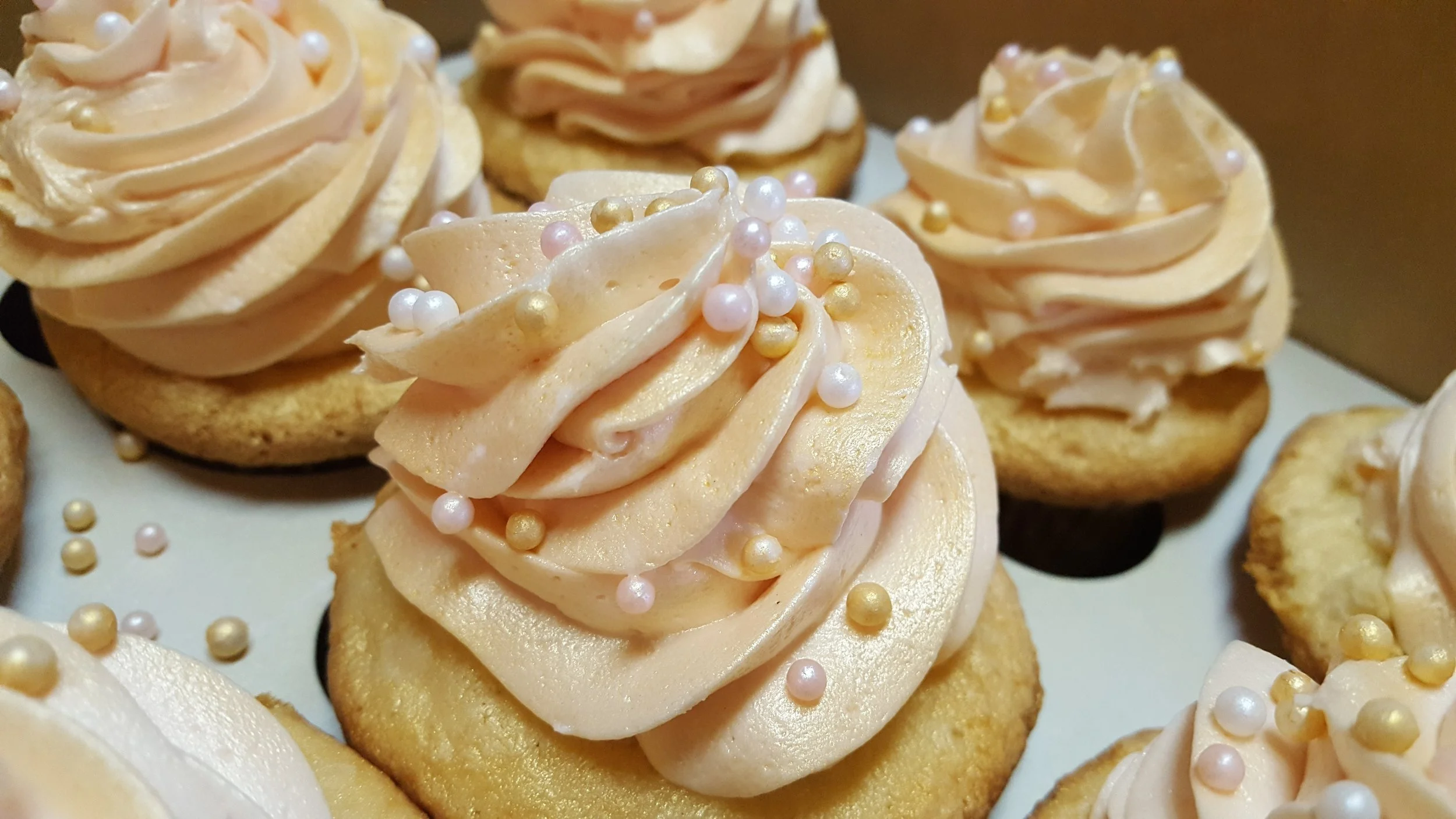 White Velvet Cupcakes with Buttercream Frosting and Sugar Pearls