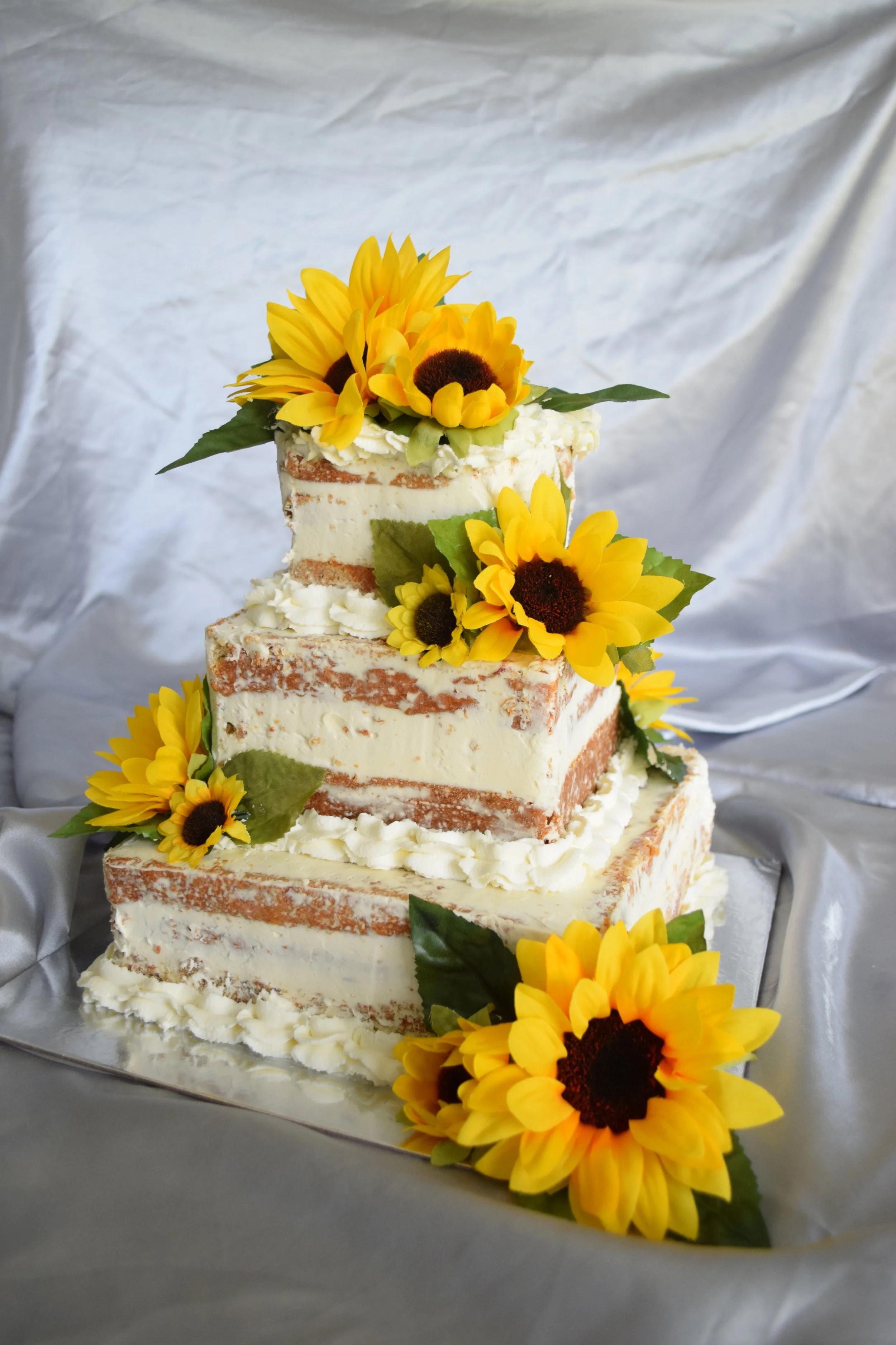 Strawberries and Cream Naked Wedding Cake with Whipped Cream Boarder and Sunflower Accents