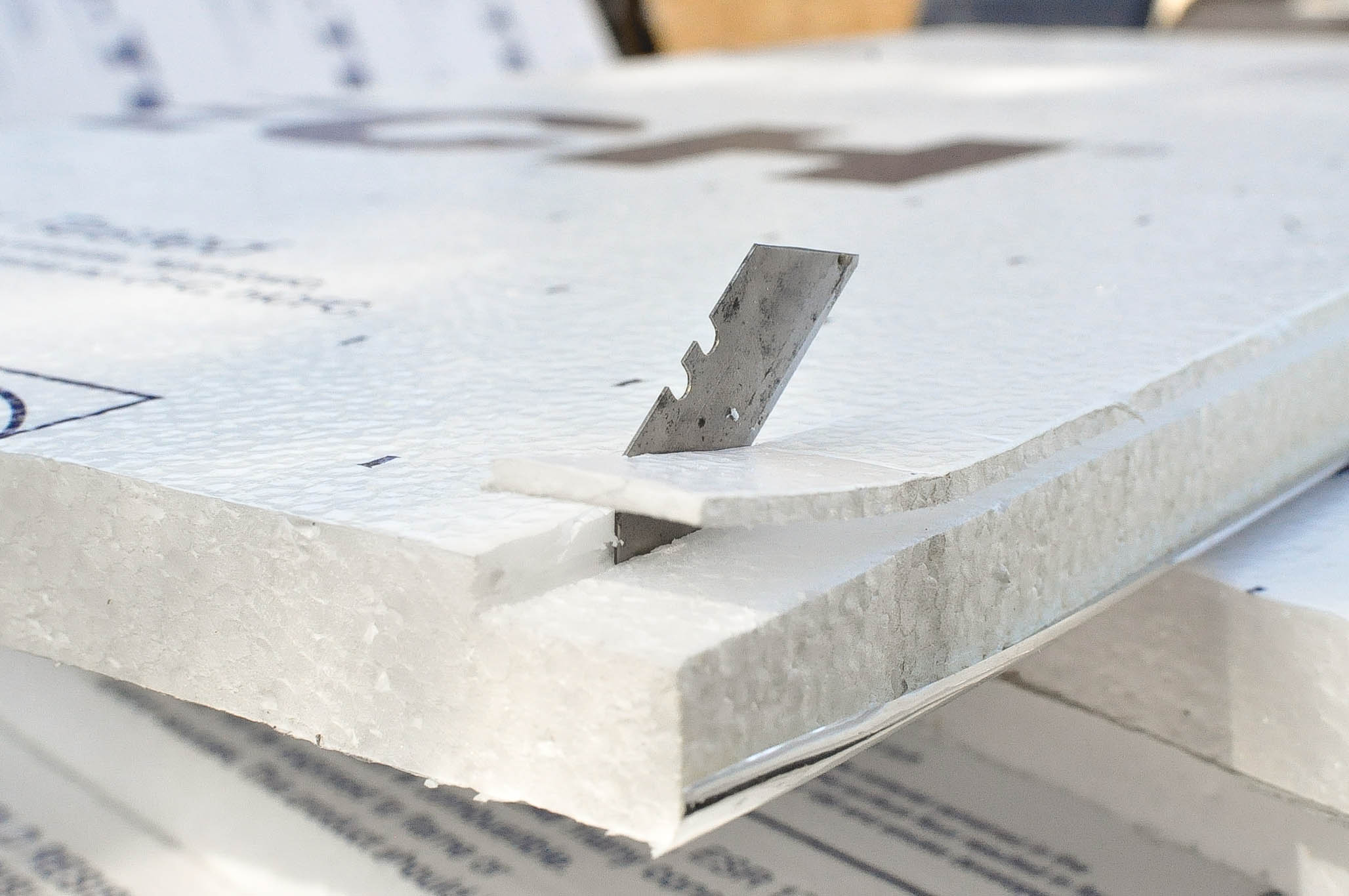 We used a razor to open finish the cut so that we could fit the insulation into the c-channel.