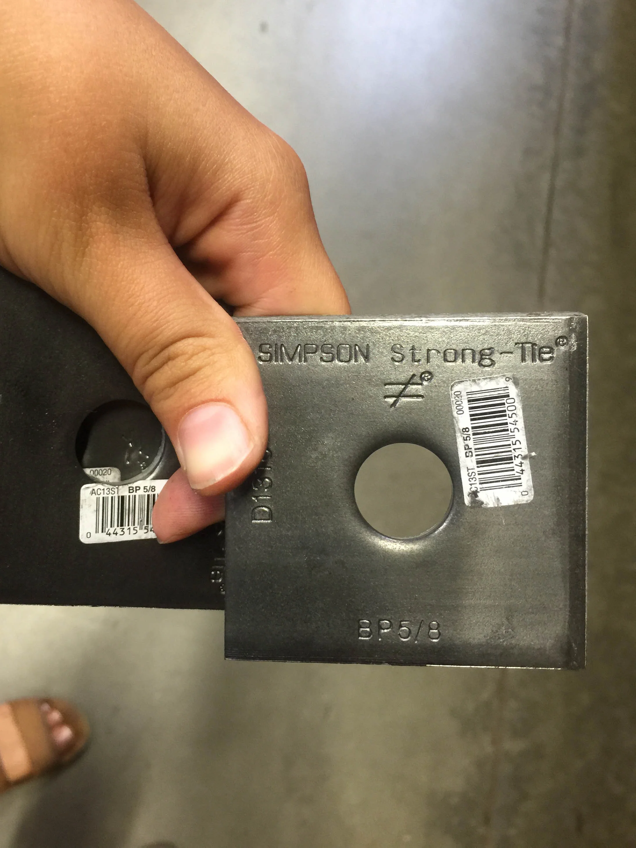 Here's one of the washer-like plates we used to serve as the bottom washer under the hold-downs.
