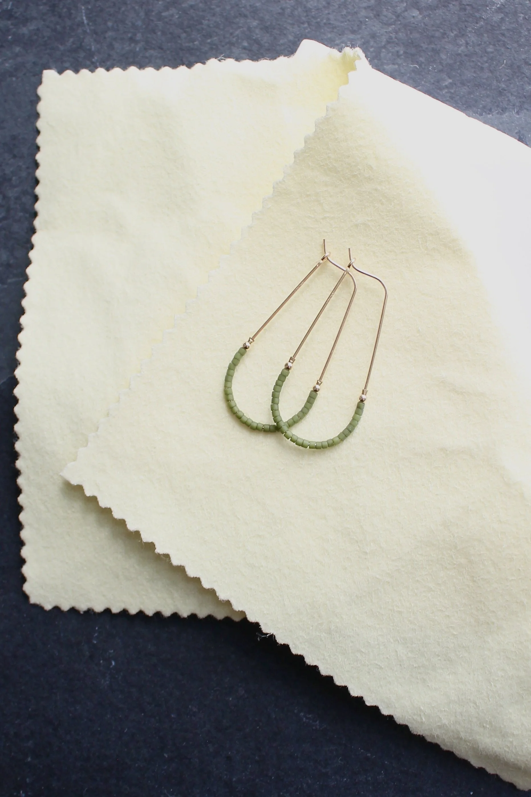 earrings on polishing cloth.jpeg