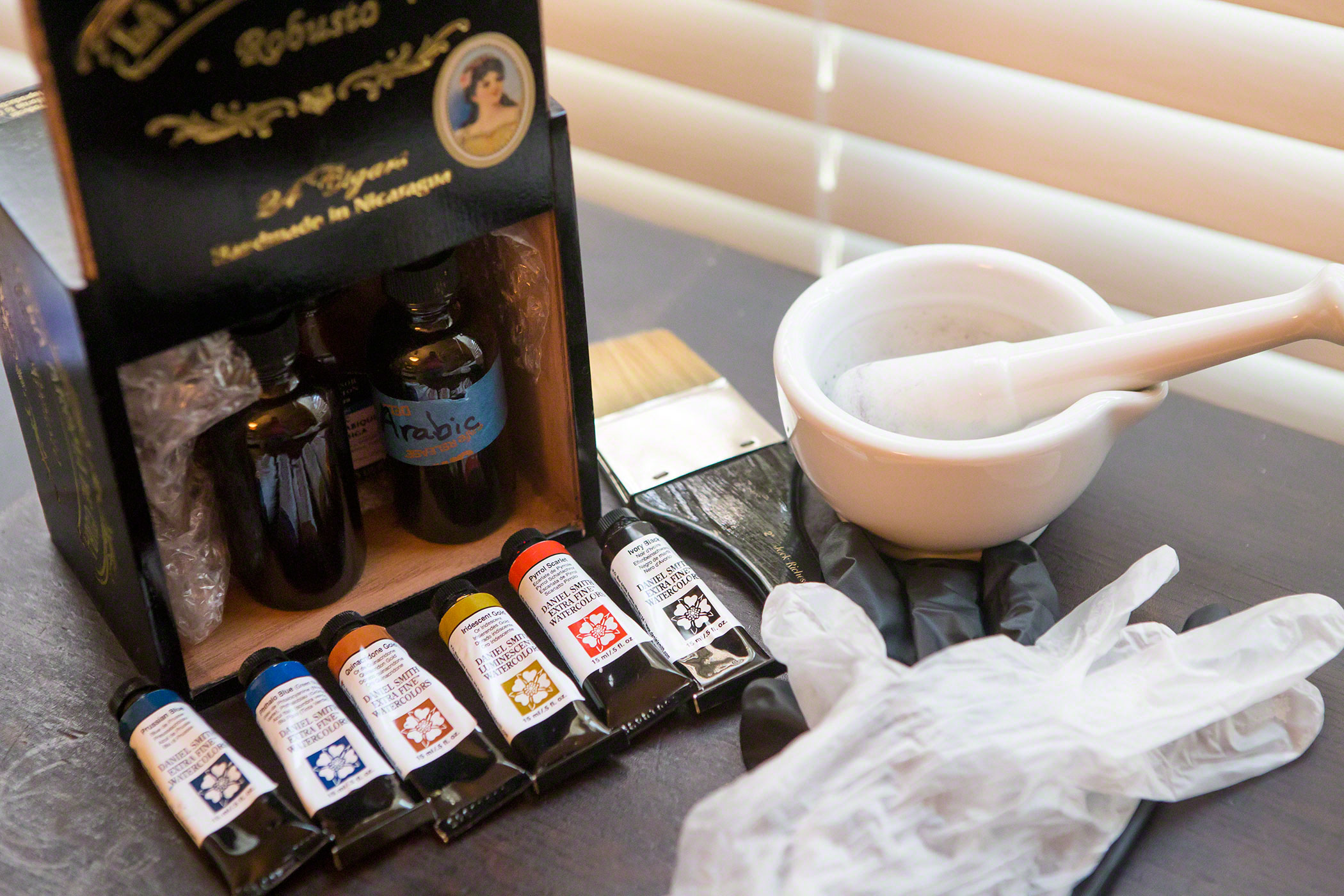 Tools of the trade: gum arabic, potassium dichromate, watercolor pigment, a smooth brush, mortar & pestle, and protective gloves