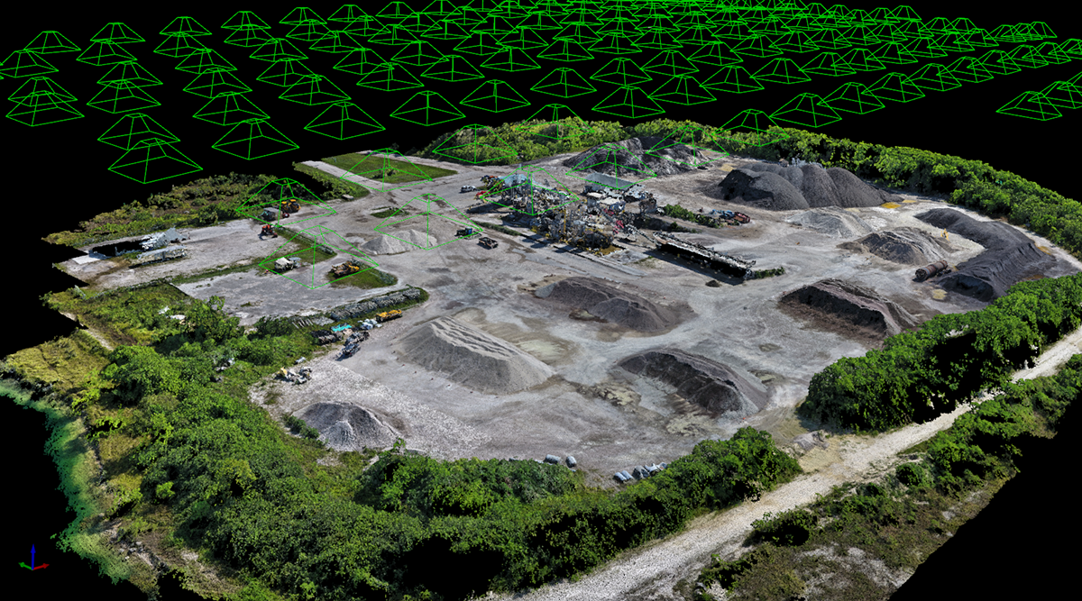 A point cloud created from photos collected by a drone with the camera positions noted by the green triangles. Image courtesy of URC Ventures