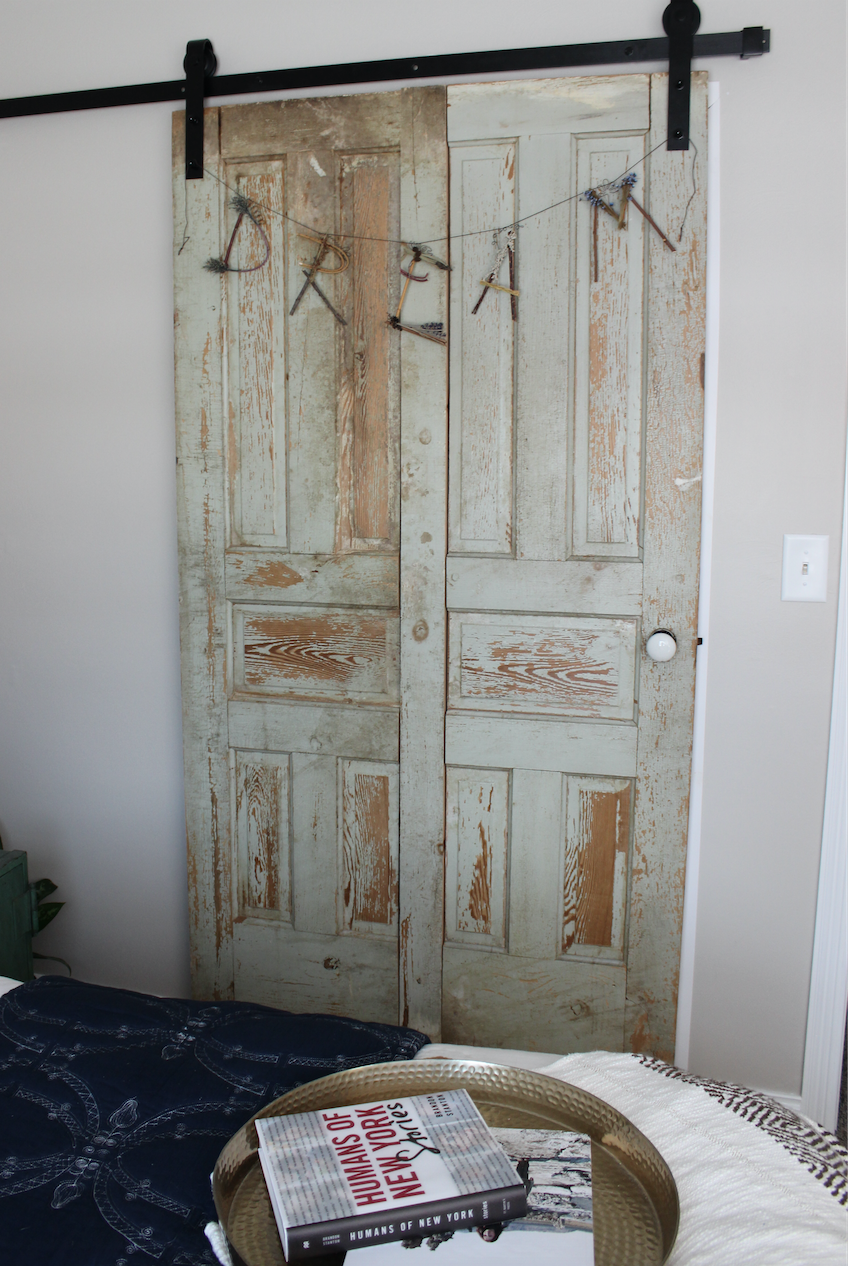 The sliding door is one of my favorite features. I love the boho feel the vintage door added (we found a pair of doors and made it into one piece) and the fact that it slides left us room to actually fit the bed!