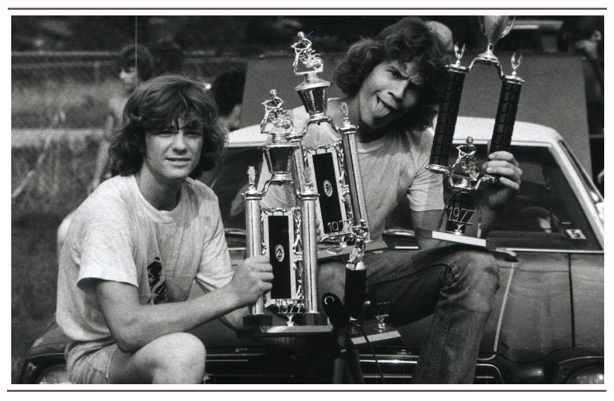Showing off the spoils of a weekend BMX race during the Summer Tour 1976. Brad (left side)