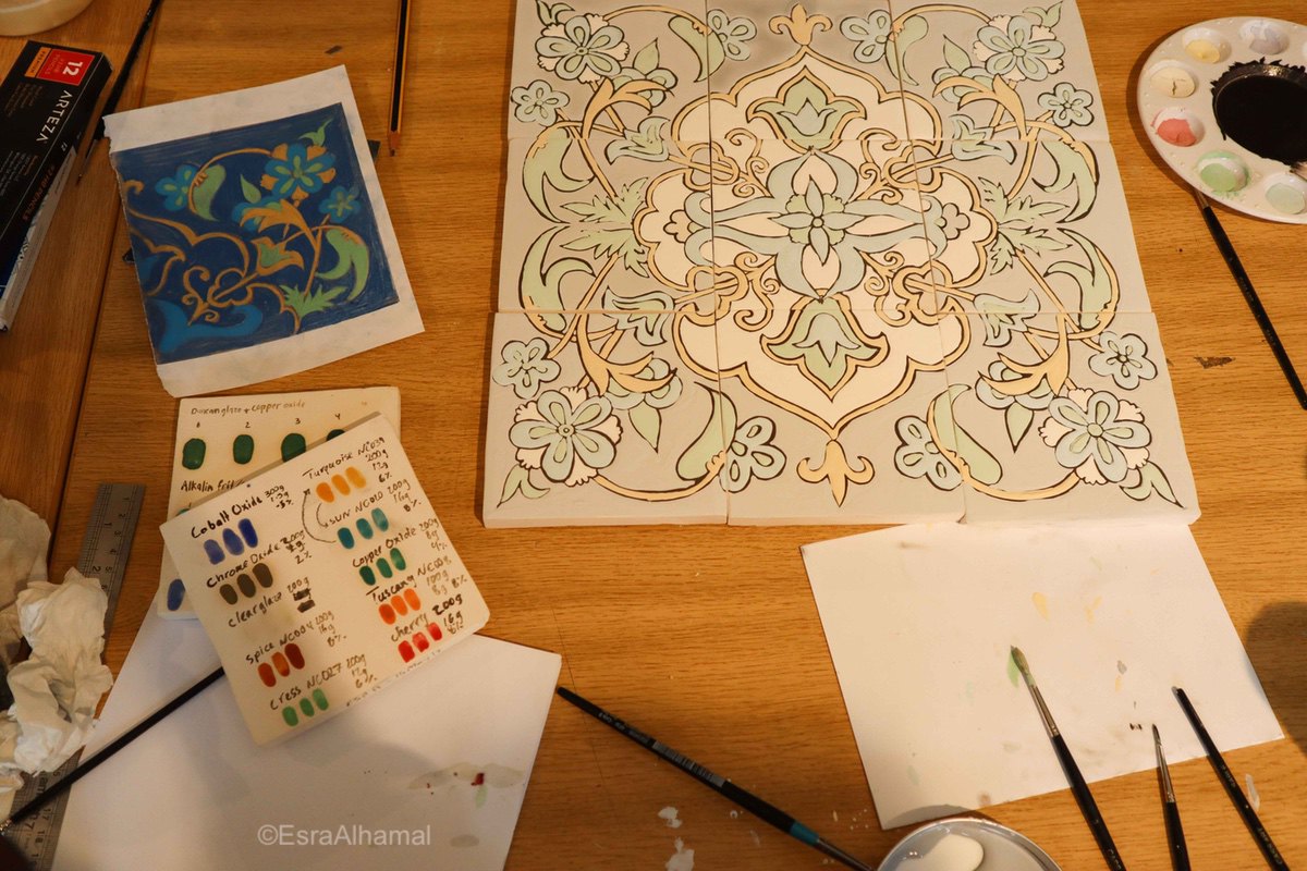 Painting a floral design on ceramic tiles