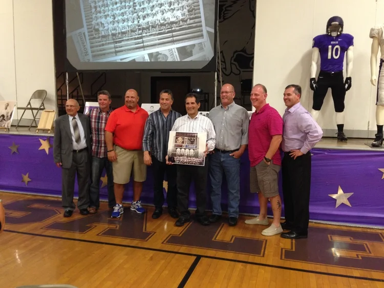 Tony Pusateri with 2014 Night of Tradition honoree Guido Ricevuto and members of the 1985 State Championship Football Team