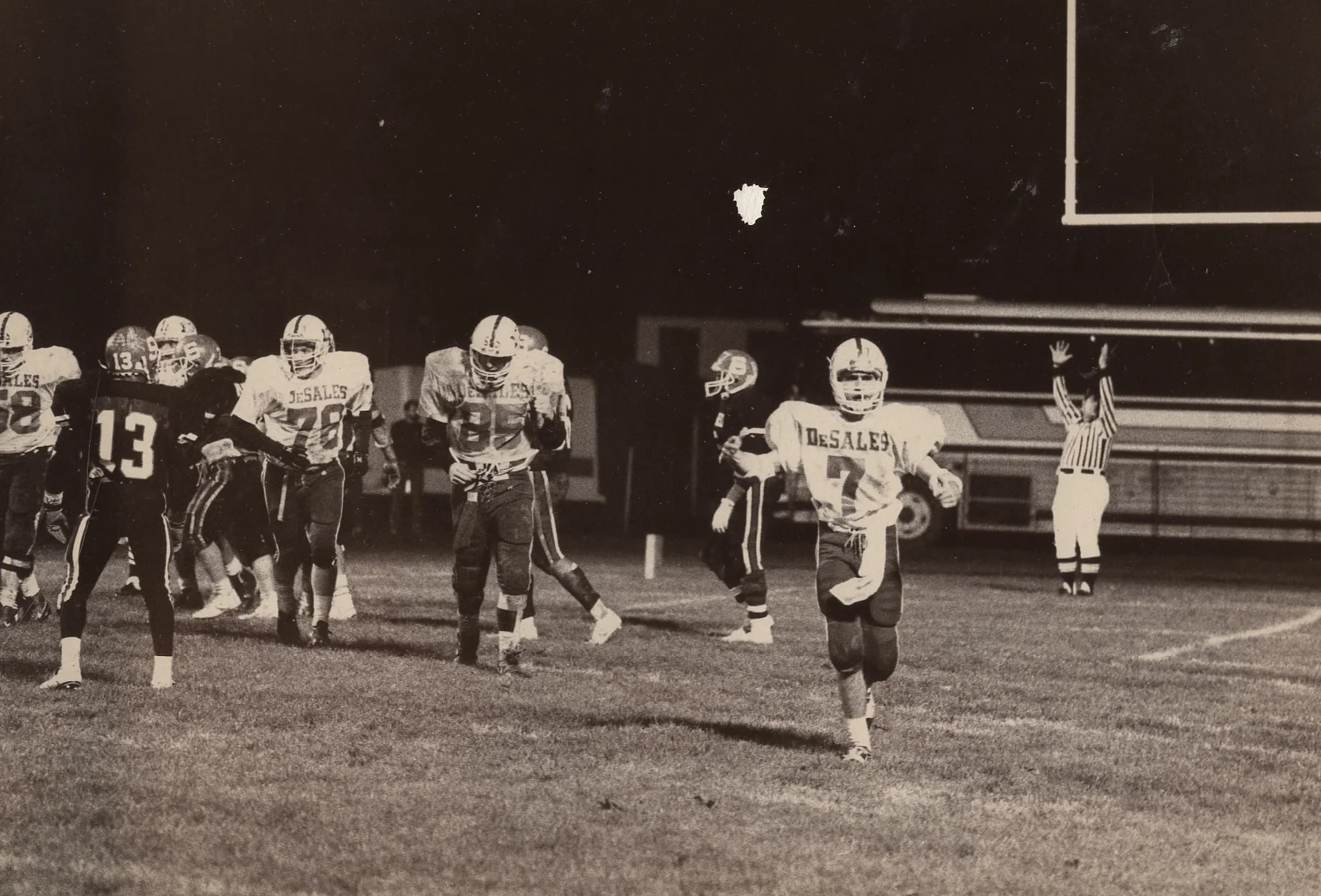 Mike Merrick (7) and Luke Fickell (85) head to the sideline after the game's first score in a DII State Semifinal
