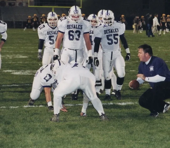 Former All-Ohio performer Kurt Murphy '96, a 2001 Assistant Coach, works with Stallion linemen 