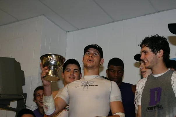 After a 160-yard rushing game, quarterback Nick Gentile prepares to drink from the Winner's Cup (photo credit - Barb Dougherty)