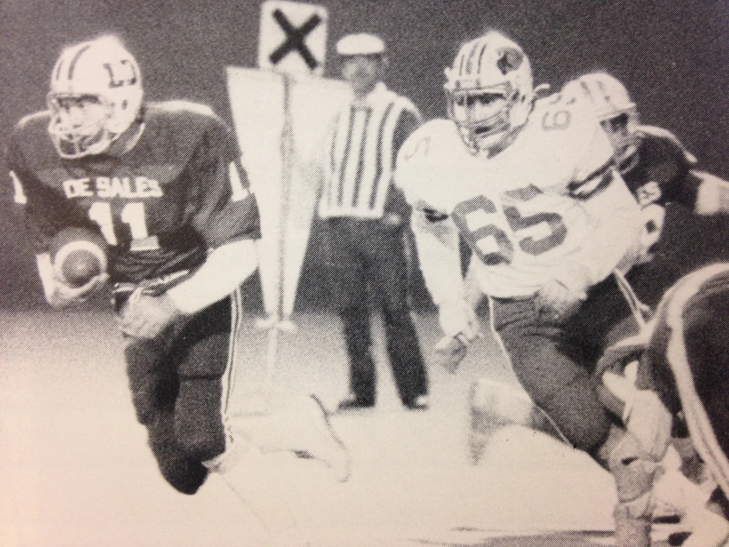Senior quarterback Bill Schwartz (11) breaks free from the Cardinals