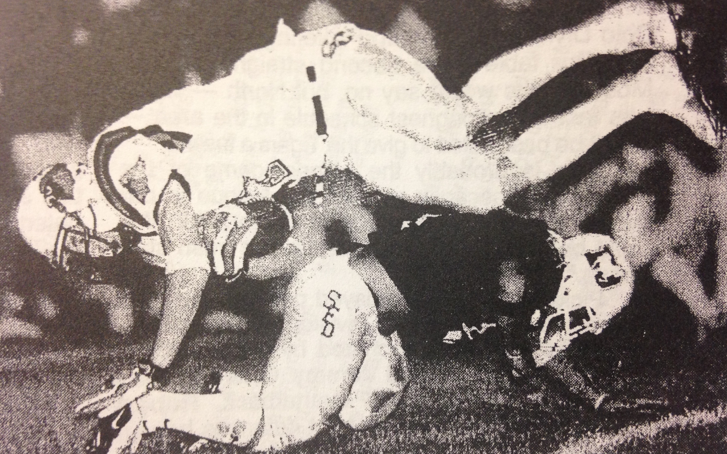 Jason Barnett, who scored on a 99-yard interception return, upends a Cardinal ball carrier 