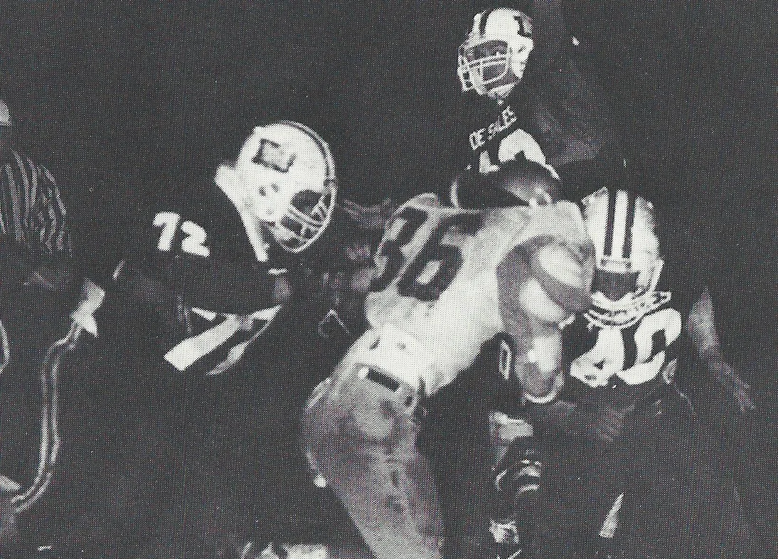 Quarterback Jack Elgin (13) gets key blocks from Rick Semeraro (72) and Joe Cua (40) 