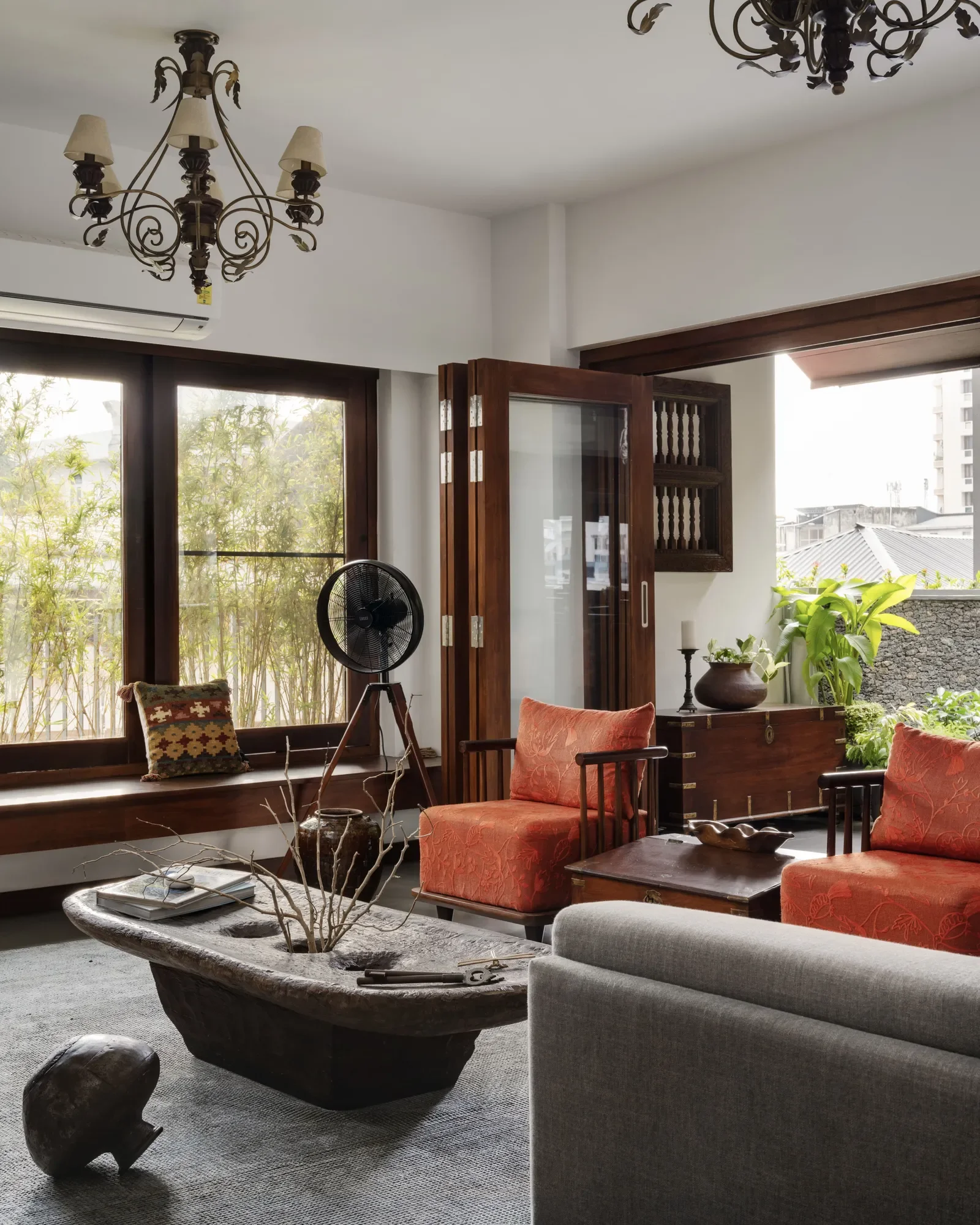  All the furniture in the home is either vintage (sourced from the old home), or made by reusing wood from the staircases of the ancestral home.  Architect: Jibu and Thomas Architects  Image: Yasith Ahmed | RAW Production 