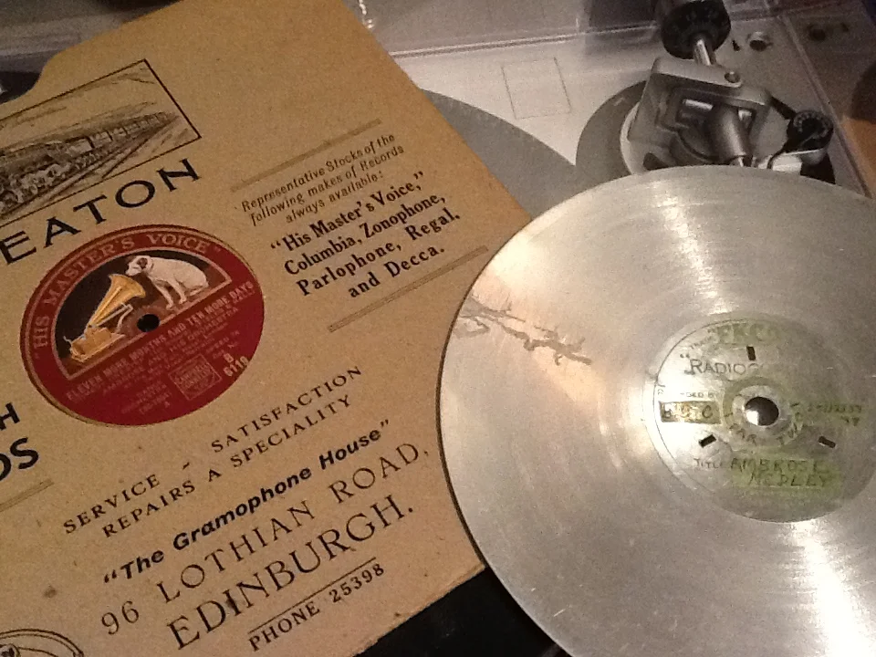 The age-worn EKCO disc of 25/12/1937 next to my grandfather's copy of "Eleven More Months and Ten Days More" bought from James Beaton's Gramophone House.