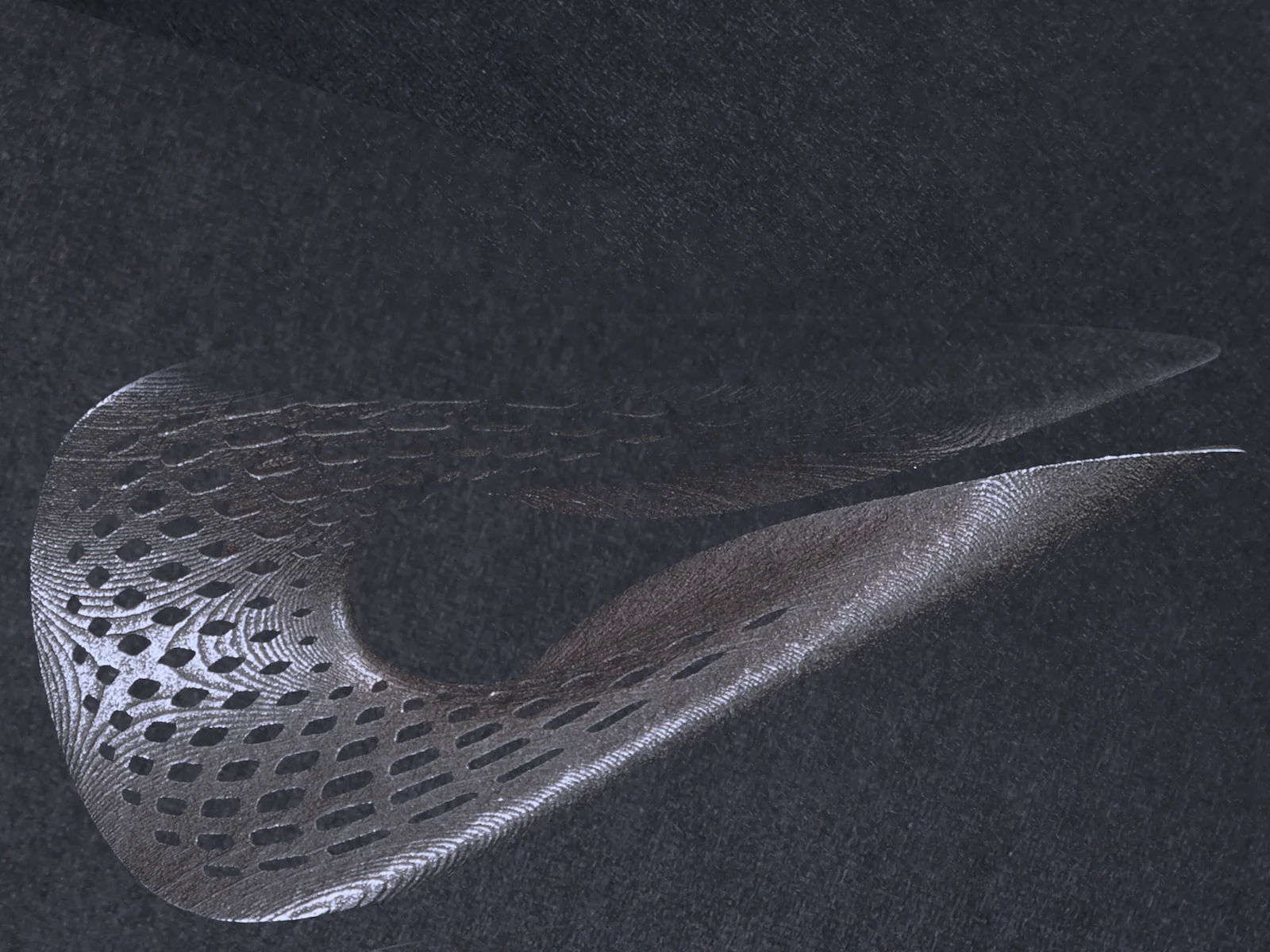 The small step lines in the steel that follow the surface topology are traces of the 3d printing process