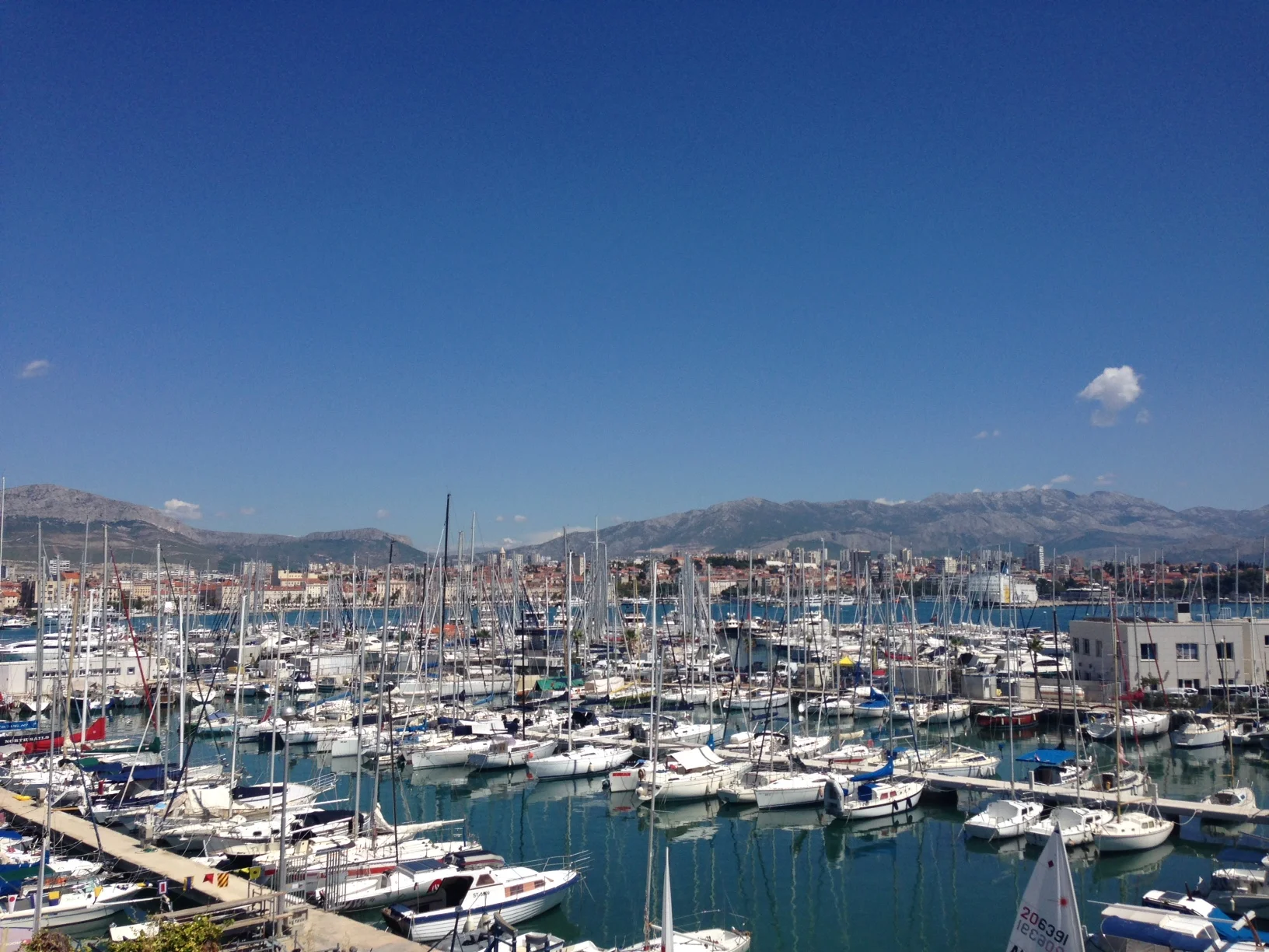 The view from the sailing club marina looking over to the city of Split and the mountains in the distance.