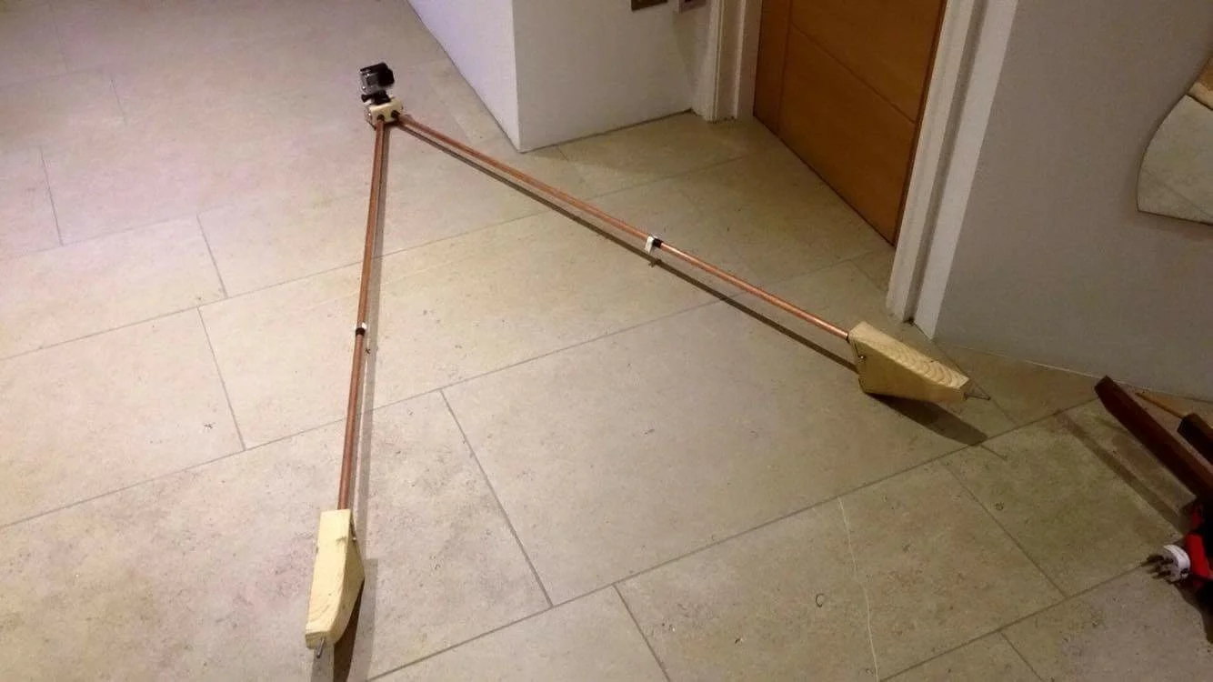 My home made Laser GoPro mount -made of a carved wooden base with copper tubing.