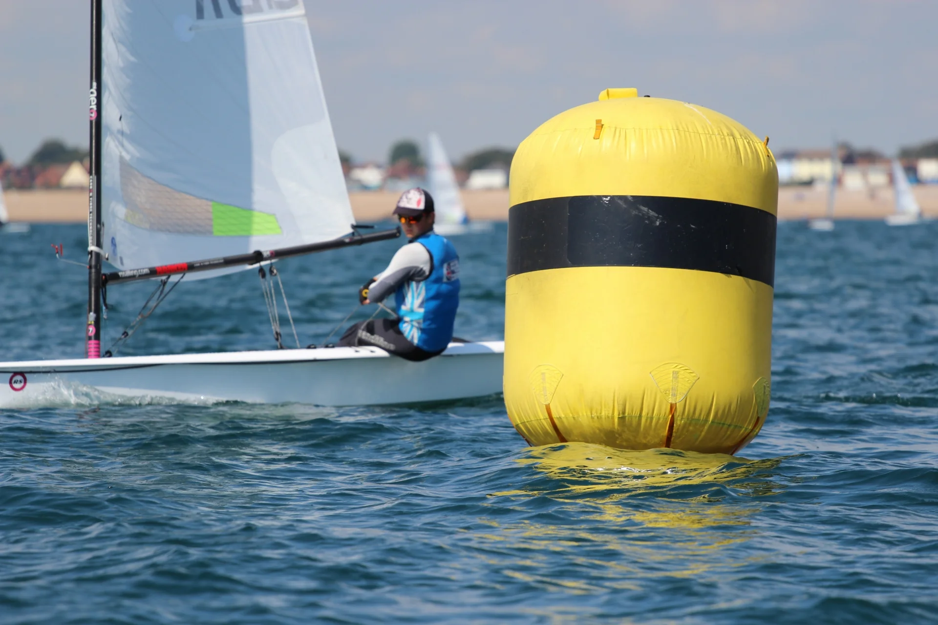 Here you can see me really looking upwind trying to find where the most wind is, where it will be and how I can best make use of it as I approach the windward mark.