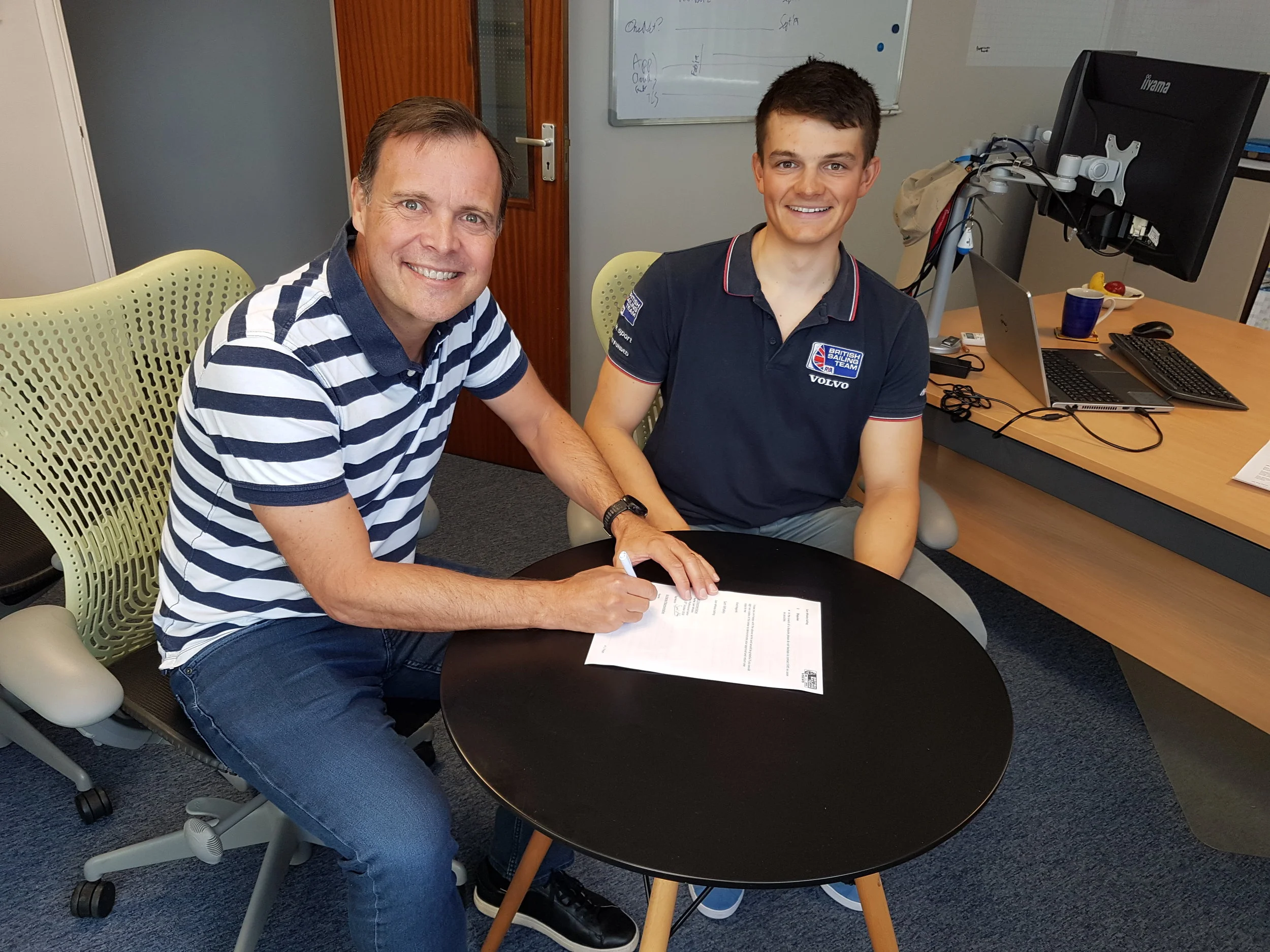 Signing the contract with CEO Phil Whitehurst.