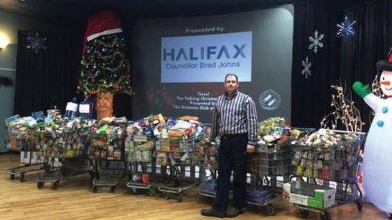 Brad Johns with 2015 donations for Beacon House. Image courtesy of Tinsel, The Talking Christmas Tree's team