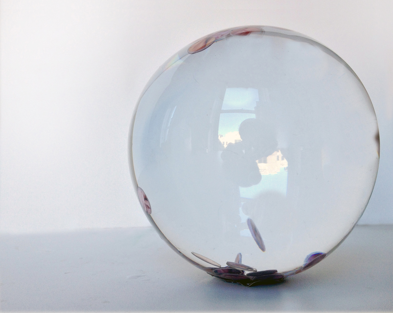   Material Engagement With Time , resined paintings immersed in liquid in a 4" diameter glass sphere ©2013 