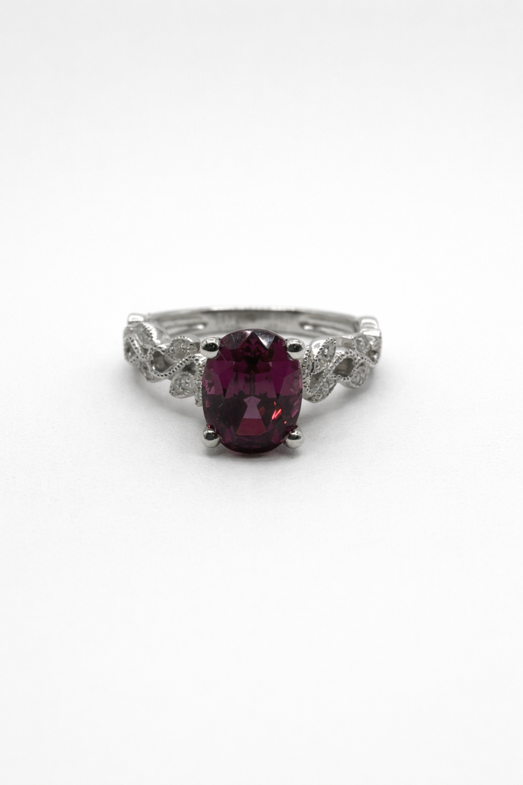 Elegant garnet ring with diamond accents.png