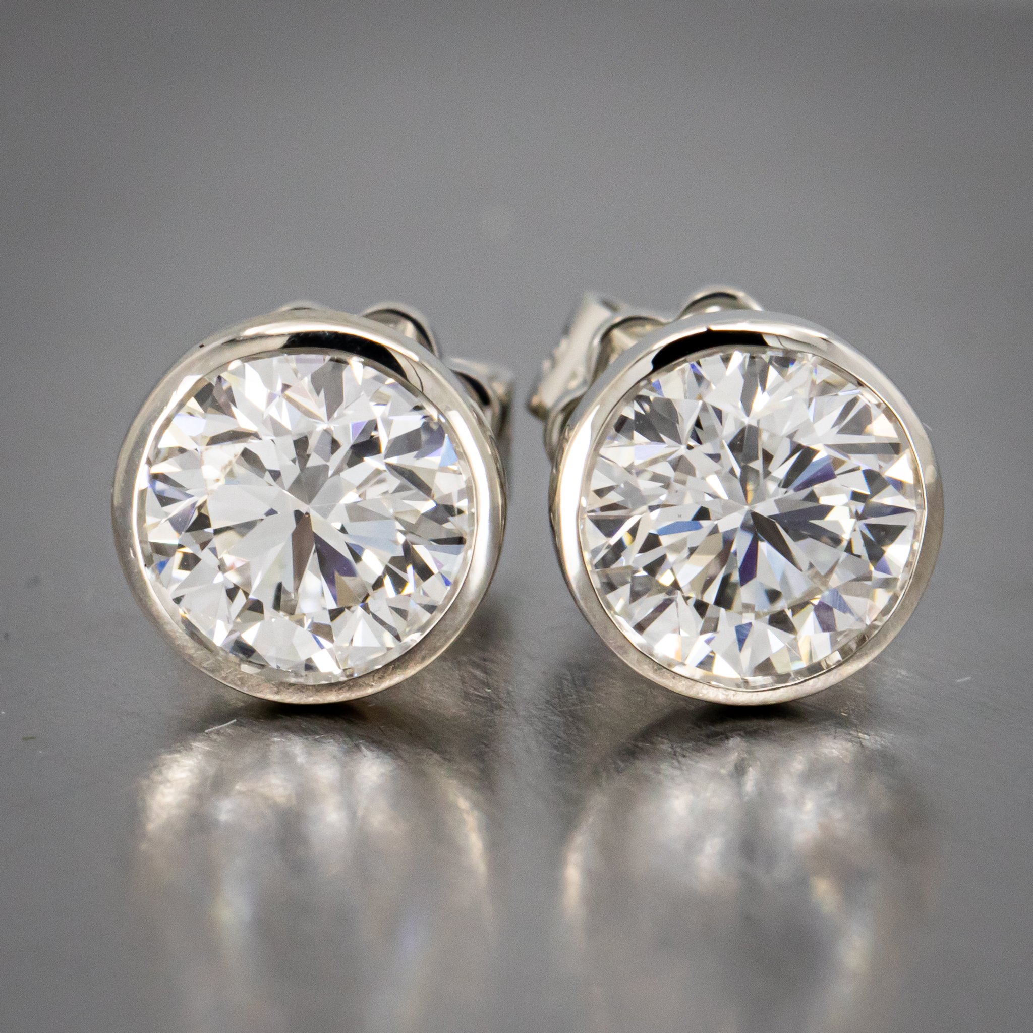 A Spin on the Modern Classic Diamond Studs - Bezel Set Platinum Stud Earrings Featuring Round Brilliant Cut Laboratory Grown Diamonds