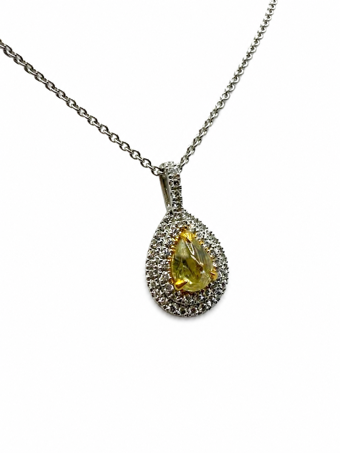 Cab-Cut Yellow Pear Diamond with a Double Halo.png