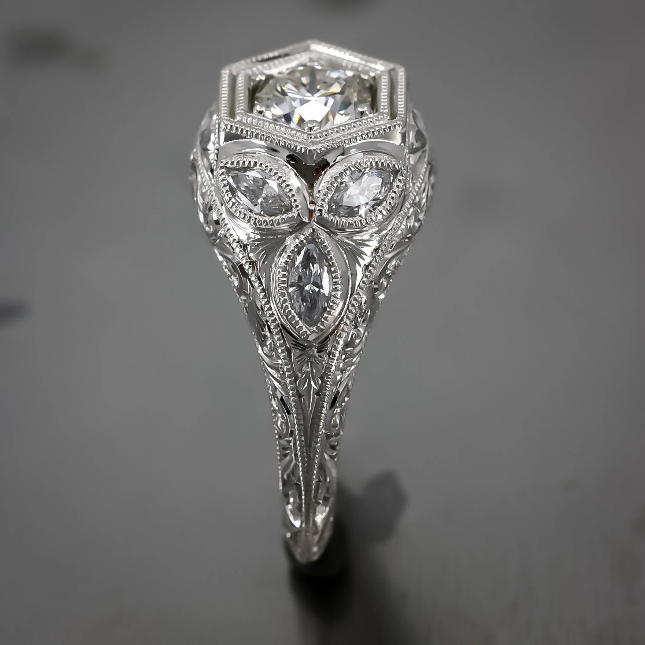 platinum-engagement-ring-vintage-replica-round-diamond-marquise-bezel-set-sides-hand-engraved-side-profile.jpg