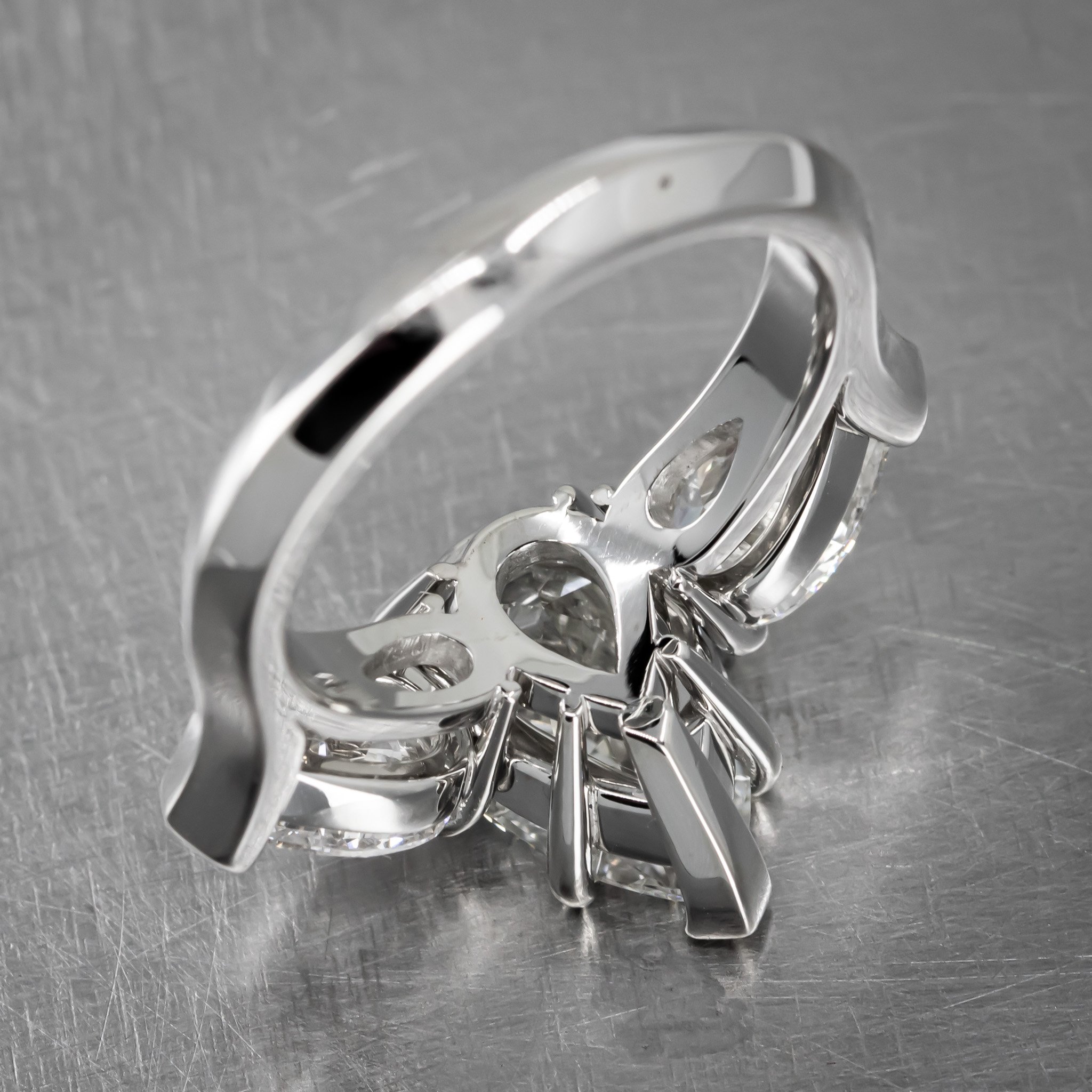 platinum-three-stone-ring-large-diamond-pear-shapes-prong-set-back-view.jpg