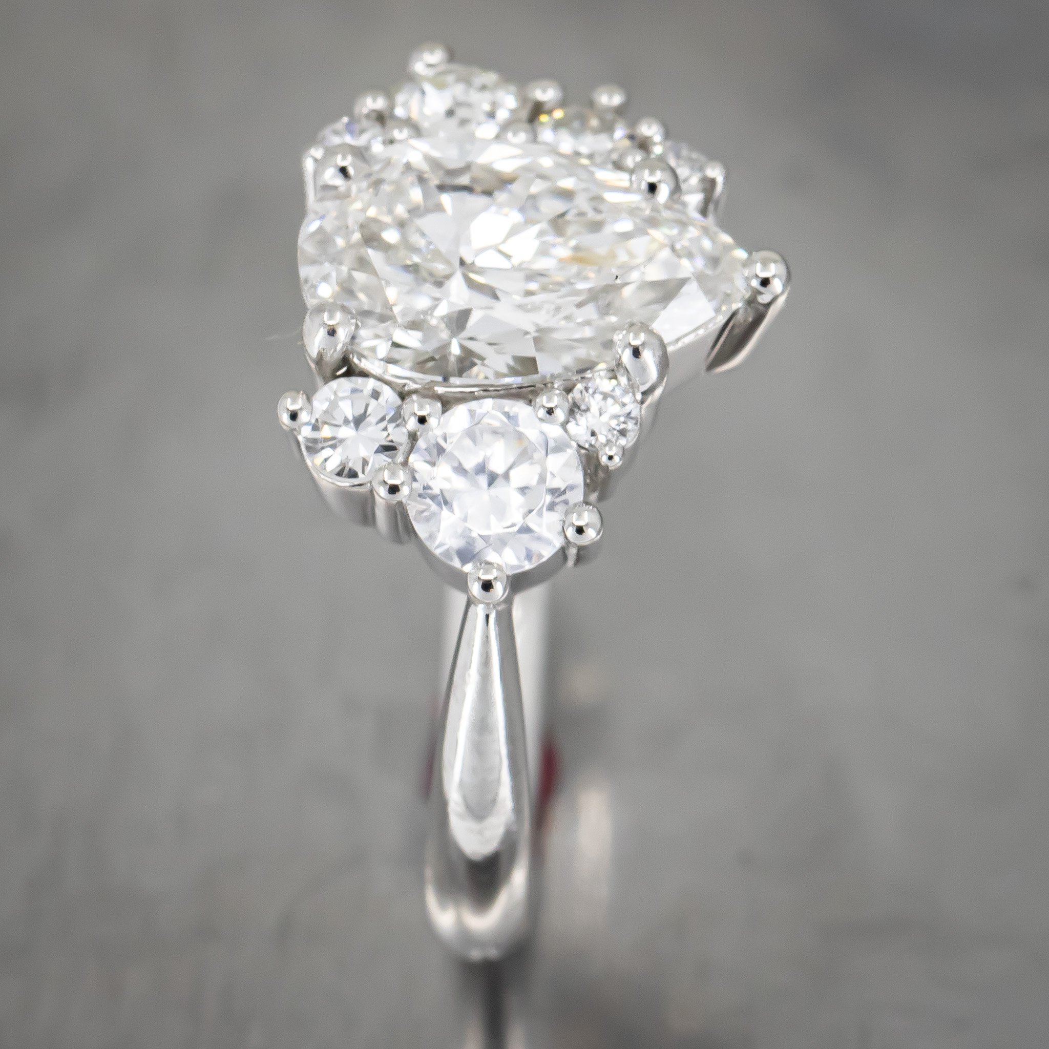 engagement-ring-custom-pear-shaped-diamond-round-diamond-cluster-asymmetrical-platinum-RT892675.jpg