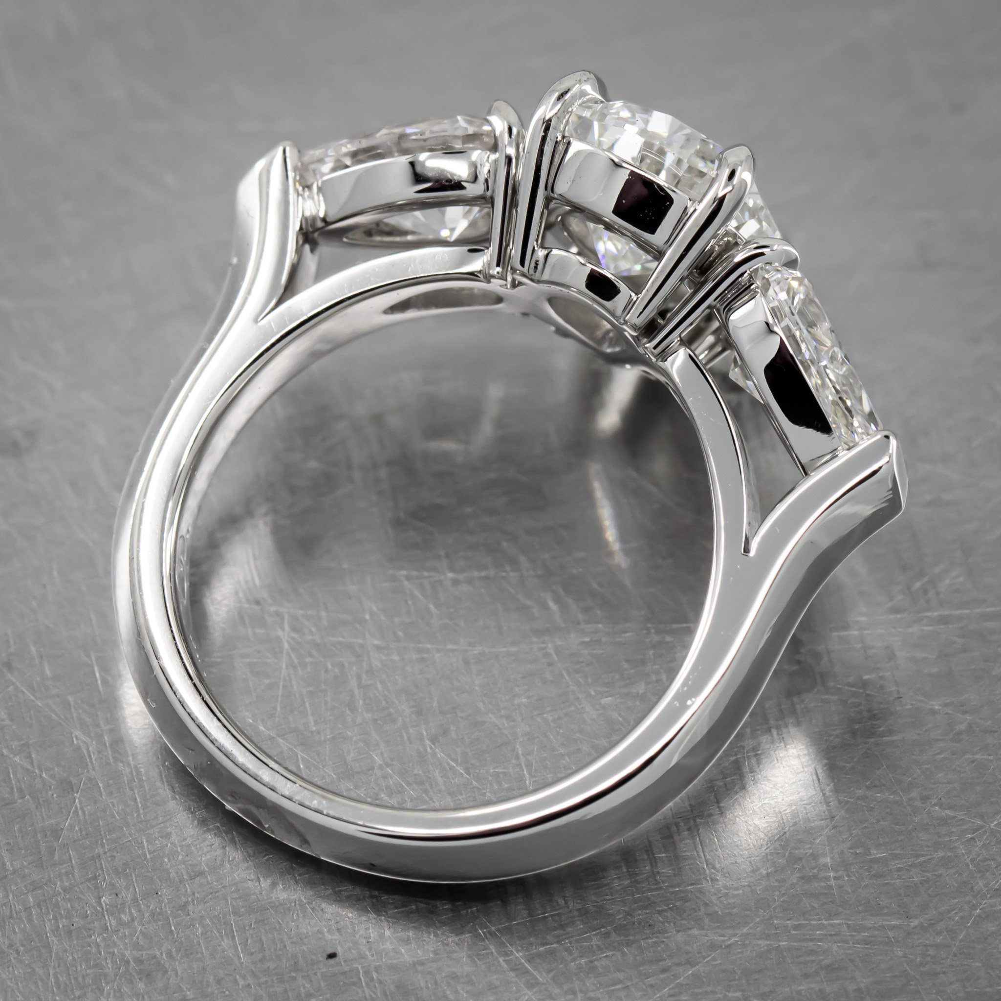 platinum-three-stone-ring-large-diamond-pear-shapes-prong-set-side-profile.jpg