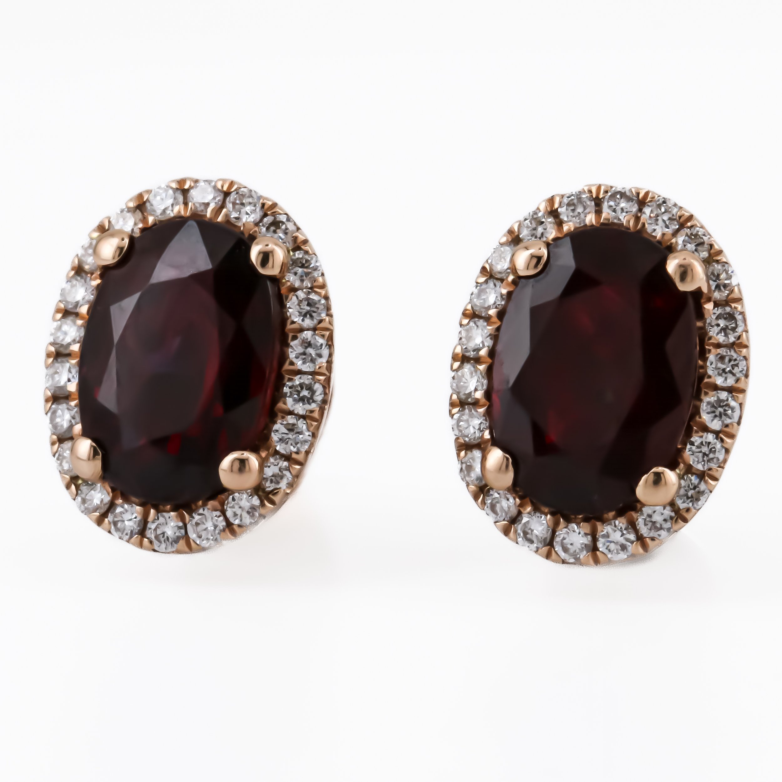 Oval Ruby and Diamond Halo Studs