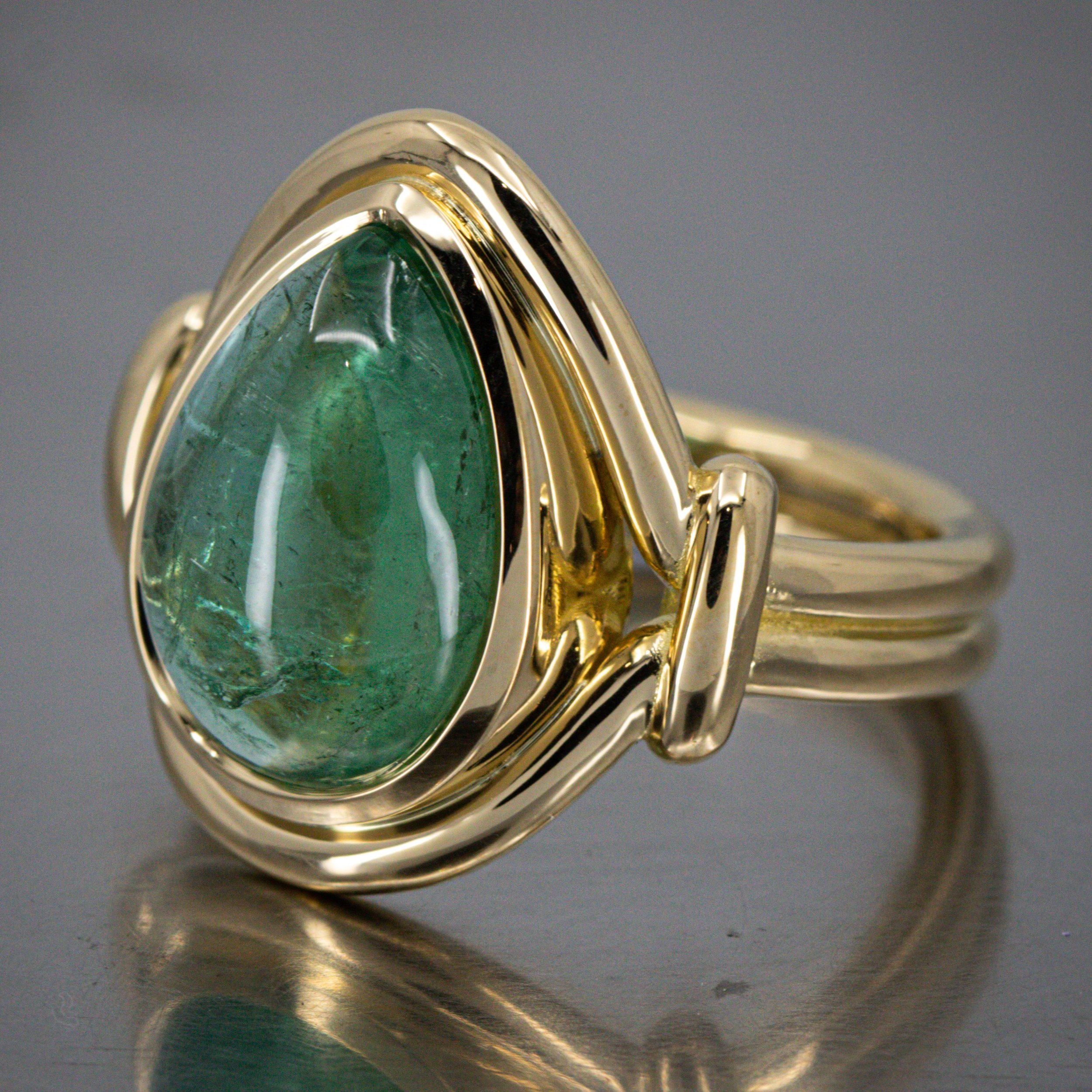pear-green-tourmaline-roman-style-gold-ring-side-view.jpg