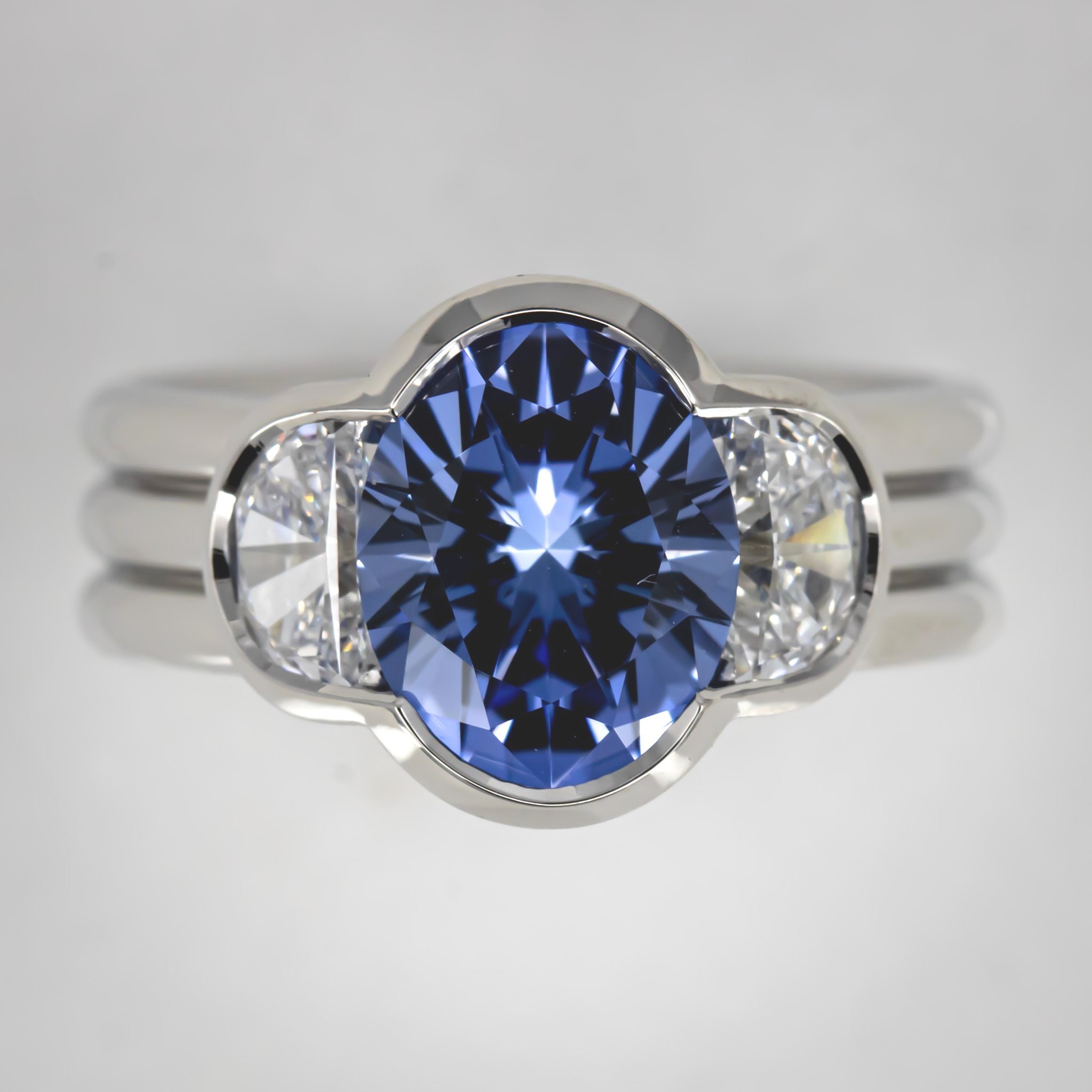 engagement-ring-custom-oval-lab-sapphire-half-moon-diamond-three-stone-bezel-three-band-platinum-RT291376.jpg