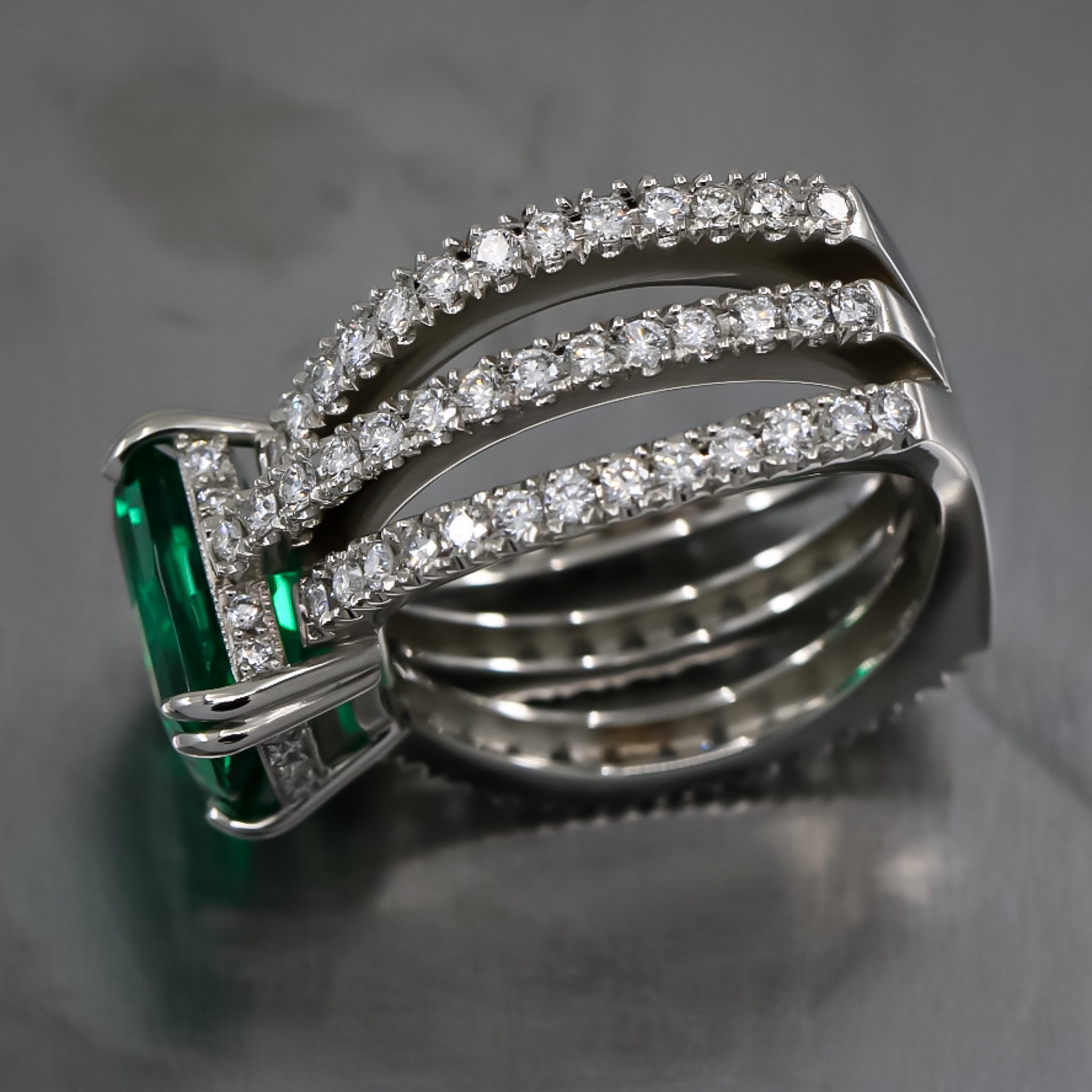 platinum-ring-lab-emerald-custom-cut-double-claw-prong-three-band-design-fishtail-set-diamond-bands-side-profile.jpg