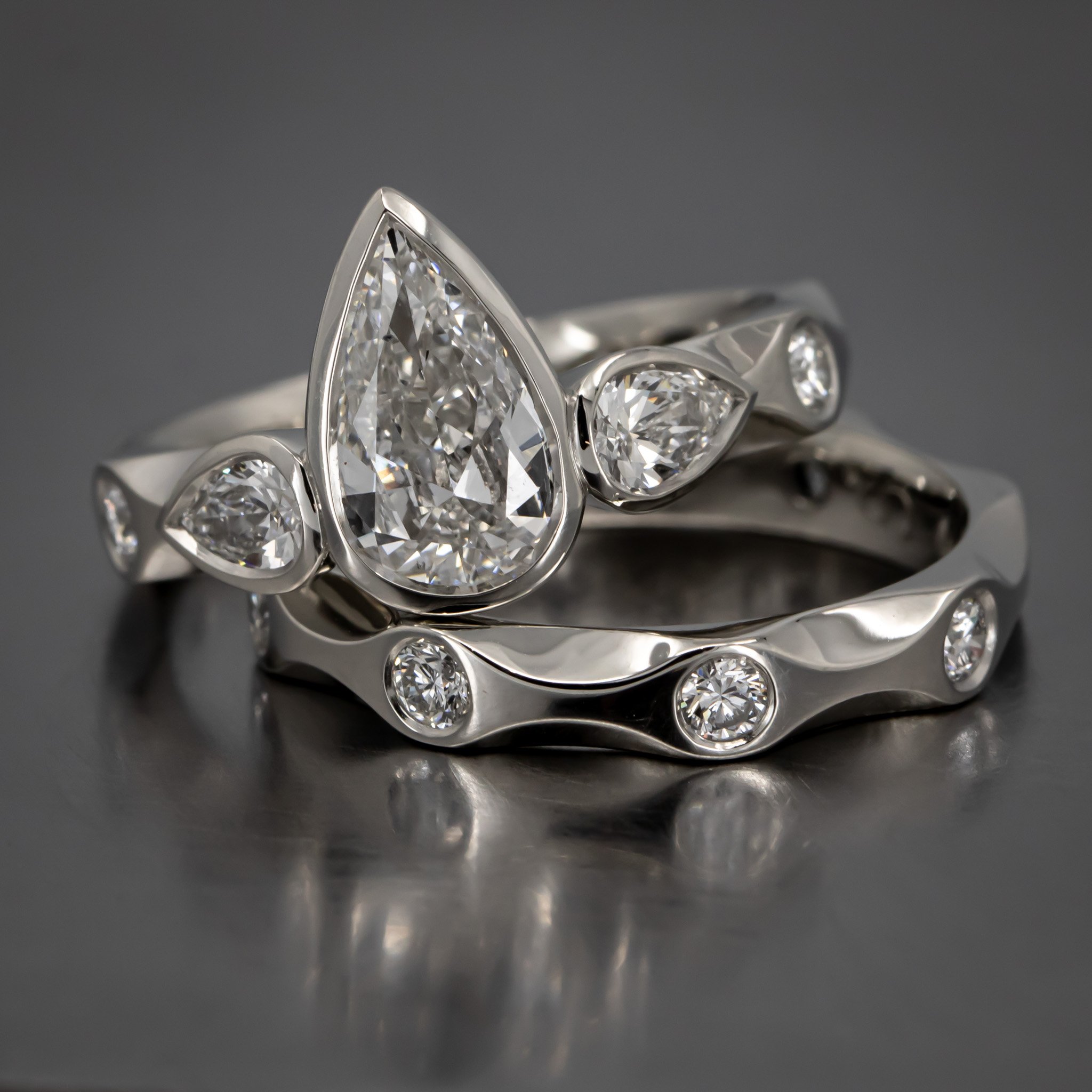engagement-ring-custom-pear-shaped-diamond-bezel-three-stone-ring-pear-shape-sides-flush-set-with-wedding-band-platinum-RT51.jpg